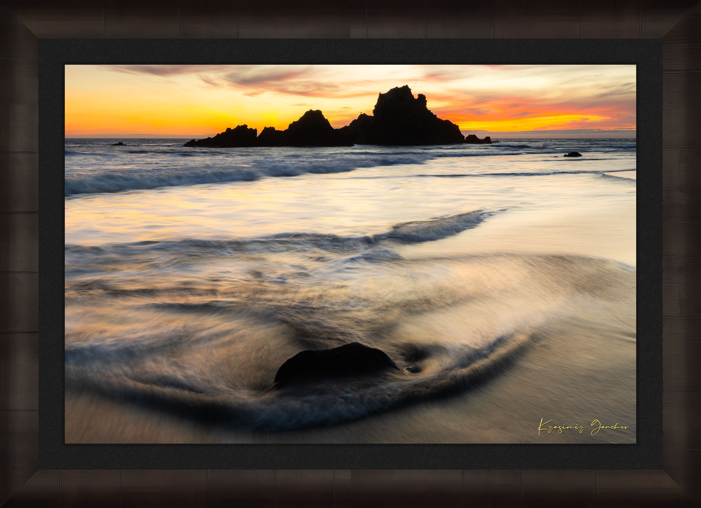 Beach scene at Pfeiffer Beach in Big Sur featuring sea stack, golden hour light, clouds, and gentle rolling waves. #Finish_Roma Dark Ash Frame & Dark Liner