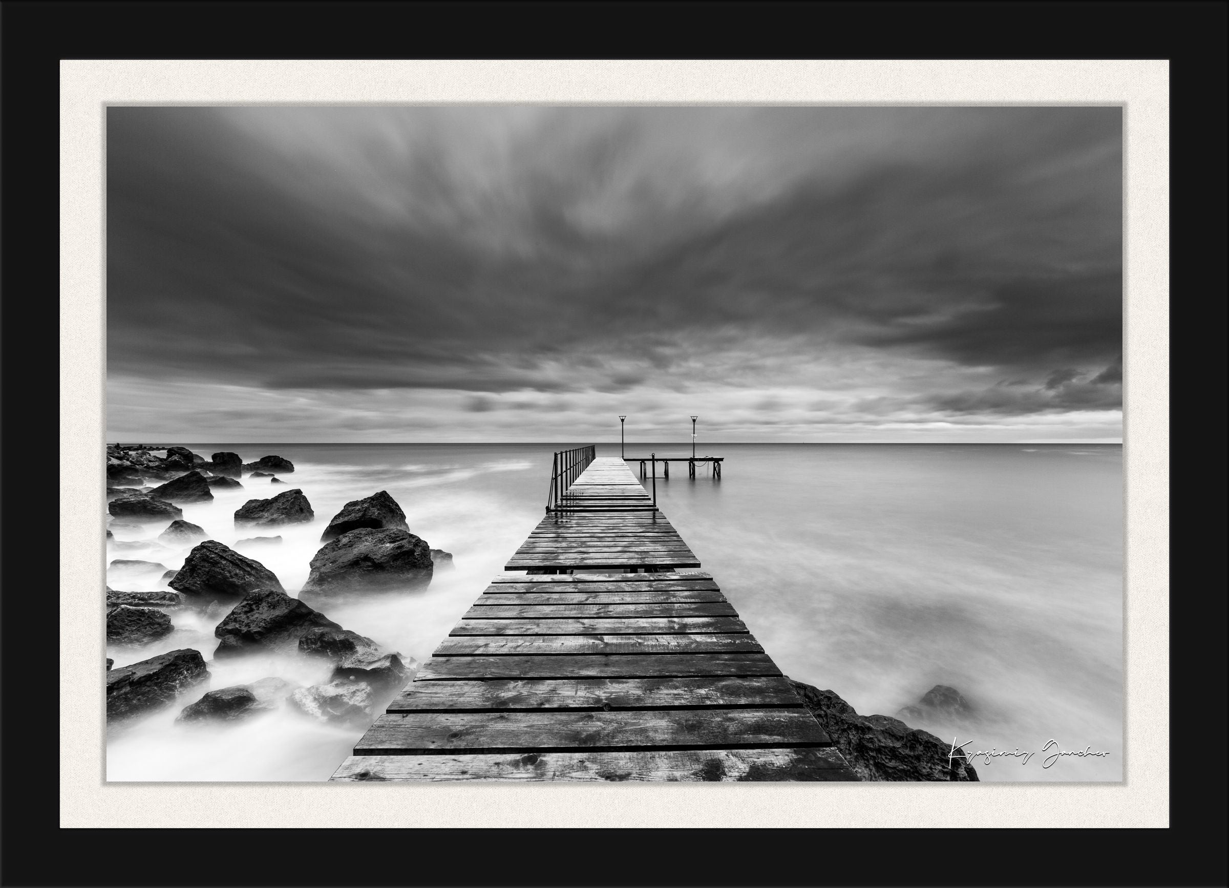 Coastal rocks and pier along the Black Sea coast during storm, wave activity visible. #Finish_Roma Satin Black Frame & Bright Liner
