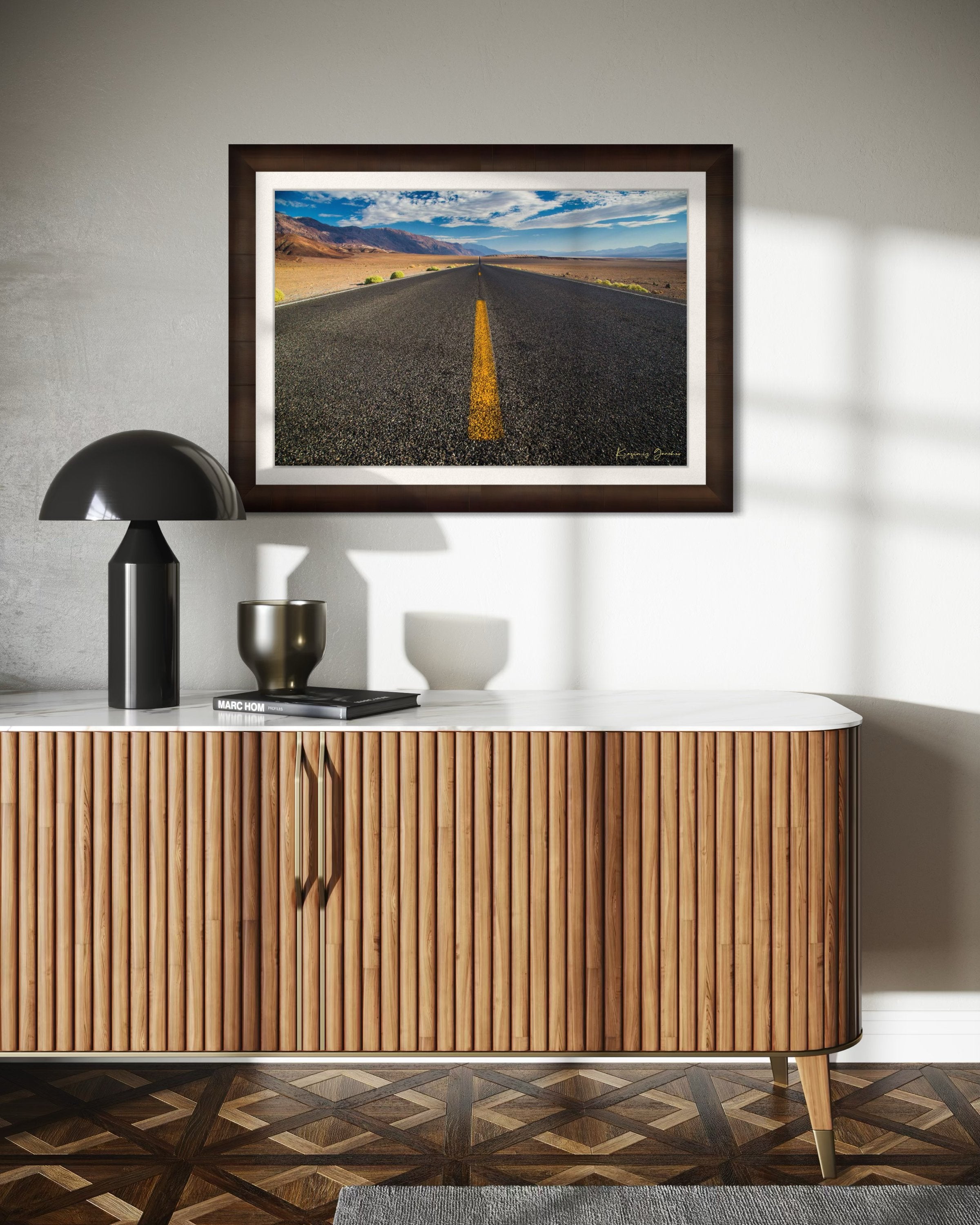 Straight desert road stretching into an open landscape of arid terrain in Death Valley National Park under overcast skies. #Finish_Roma Cigar Leaf Frame & Bright Liner