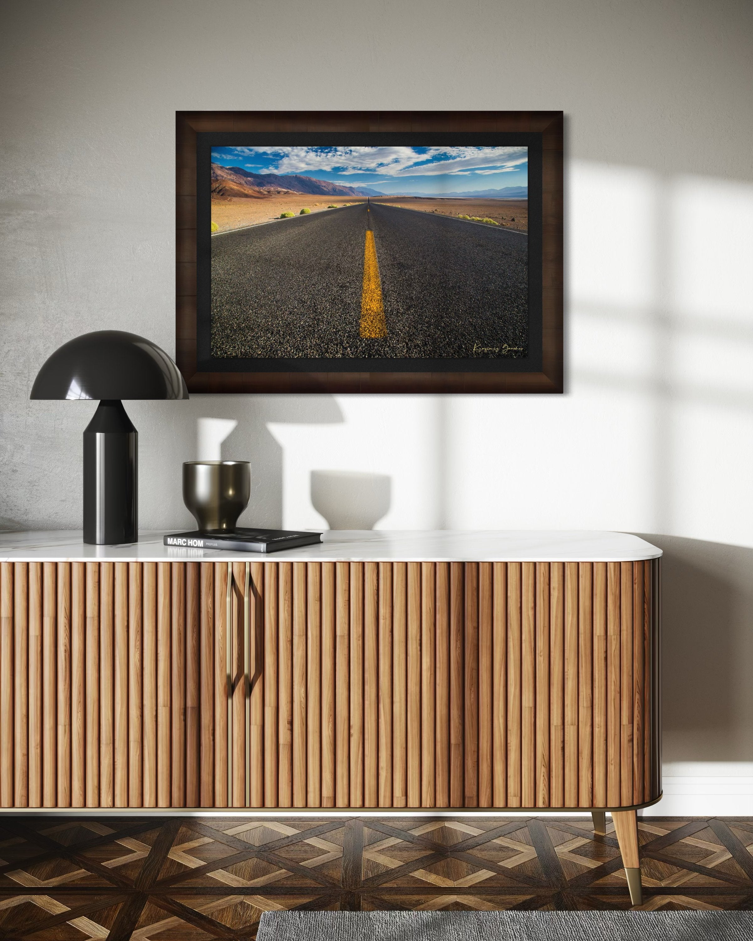 Straight desert road stretching into an open landscape of arid terrain in Death Valley National Park under overcast skies. #Finish_Roma Cigar Leaf Frame & Dark Liner