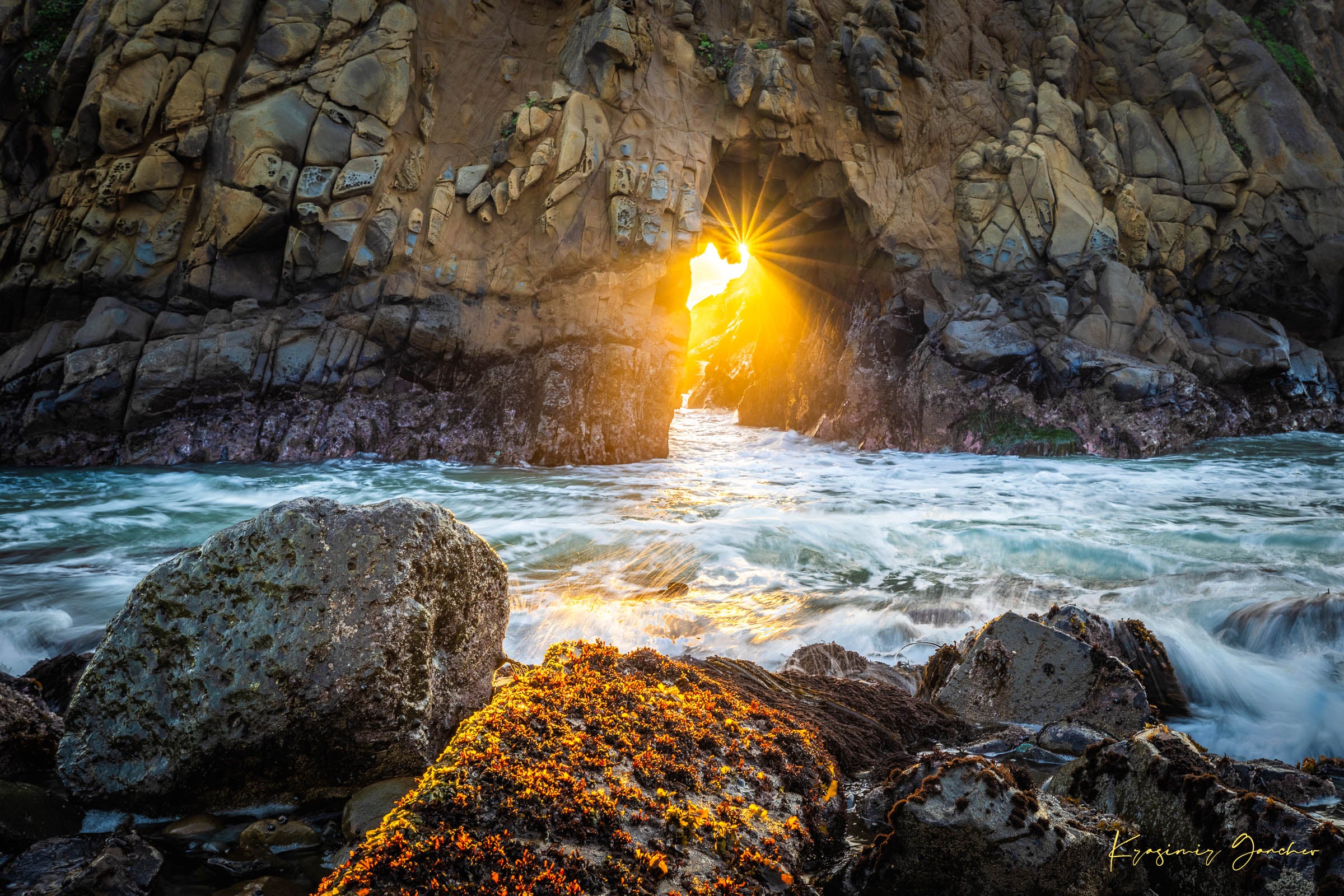 Golden-hour photograph of a coastal arch formed by erosion at Big Sur's rugged shoreline, featuring boulders and open sea. #Finish_Acrylic Recess