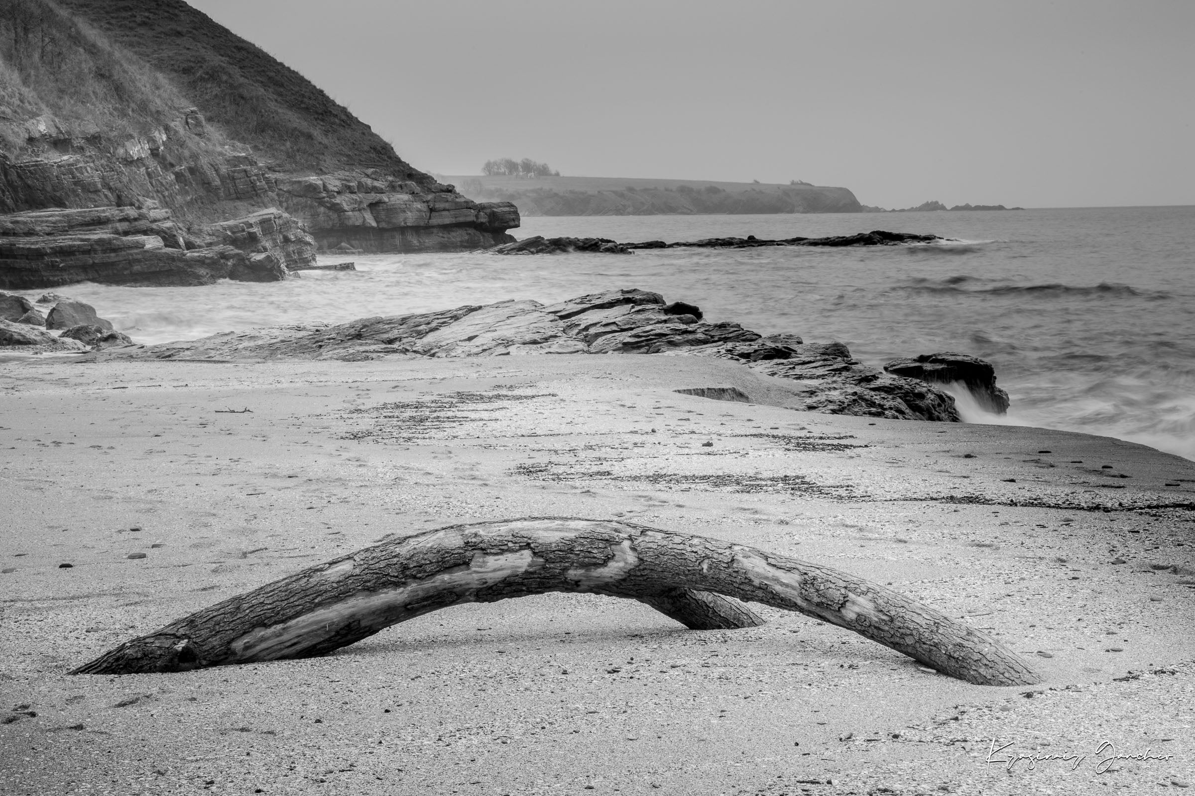 Weathered driftwood on Ahtopol beach along the Black Sea during daylight with haze. #Finish_Acrylic Recess
