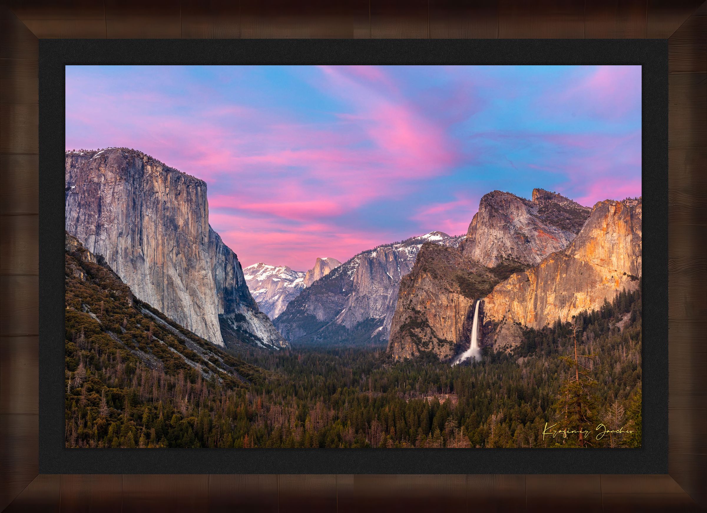Yosemite Valley view of El Capitan monolith beneath snowy peaks, soft rose-lavender sky and cloud-covered horizon. #Finish_Roma Cigar Leaf Frame & Dark Liner