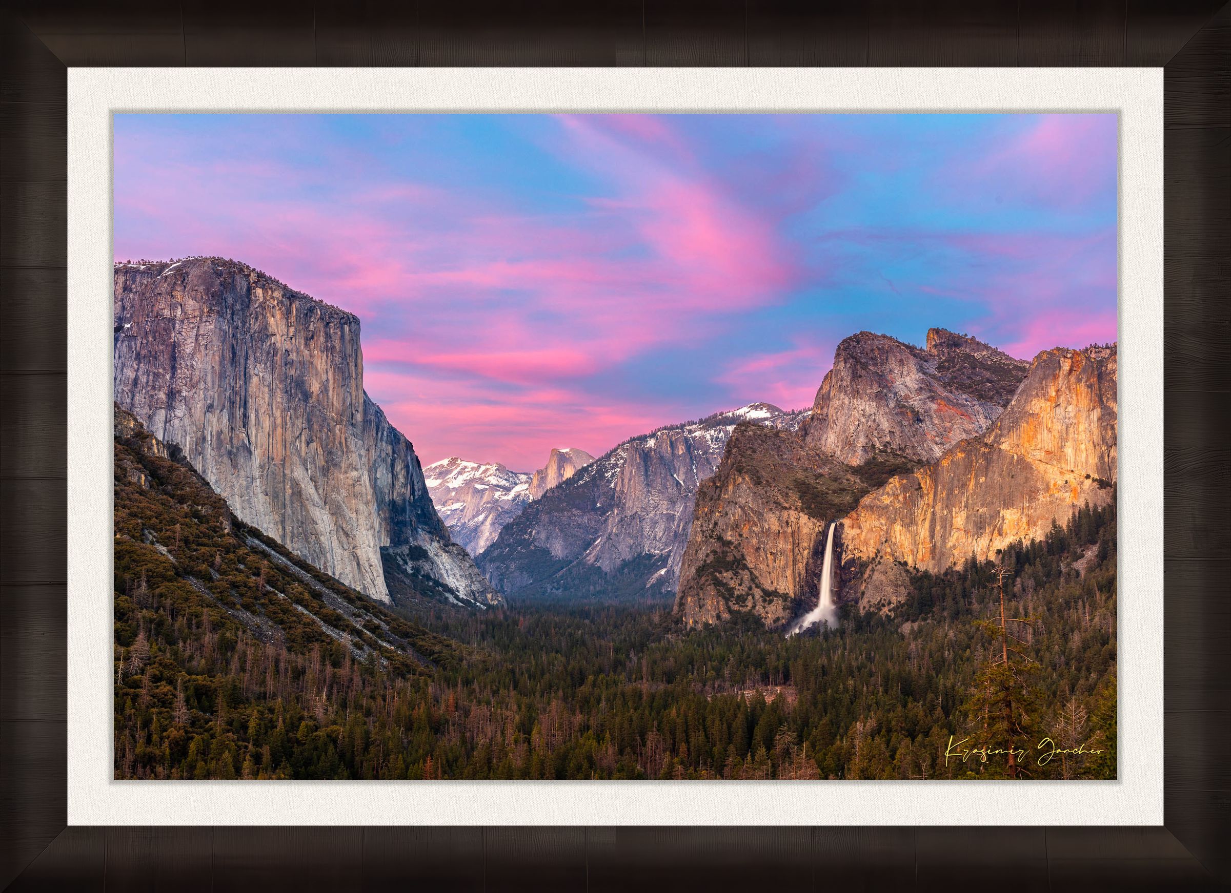 Yosemite Valley view of El Capitan monolith beneath snowy peaks, soft rose-lavender sky and cloud-covered horizon. #Finish_Roma Dark Ash Frame & Bright Liner