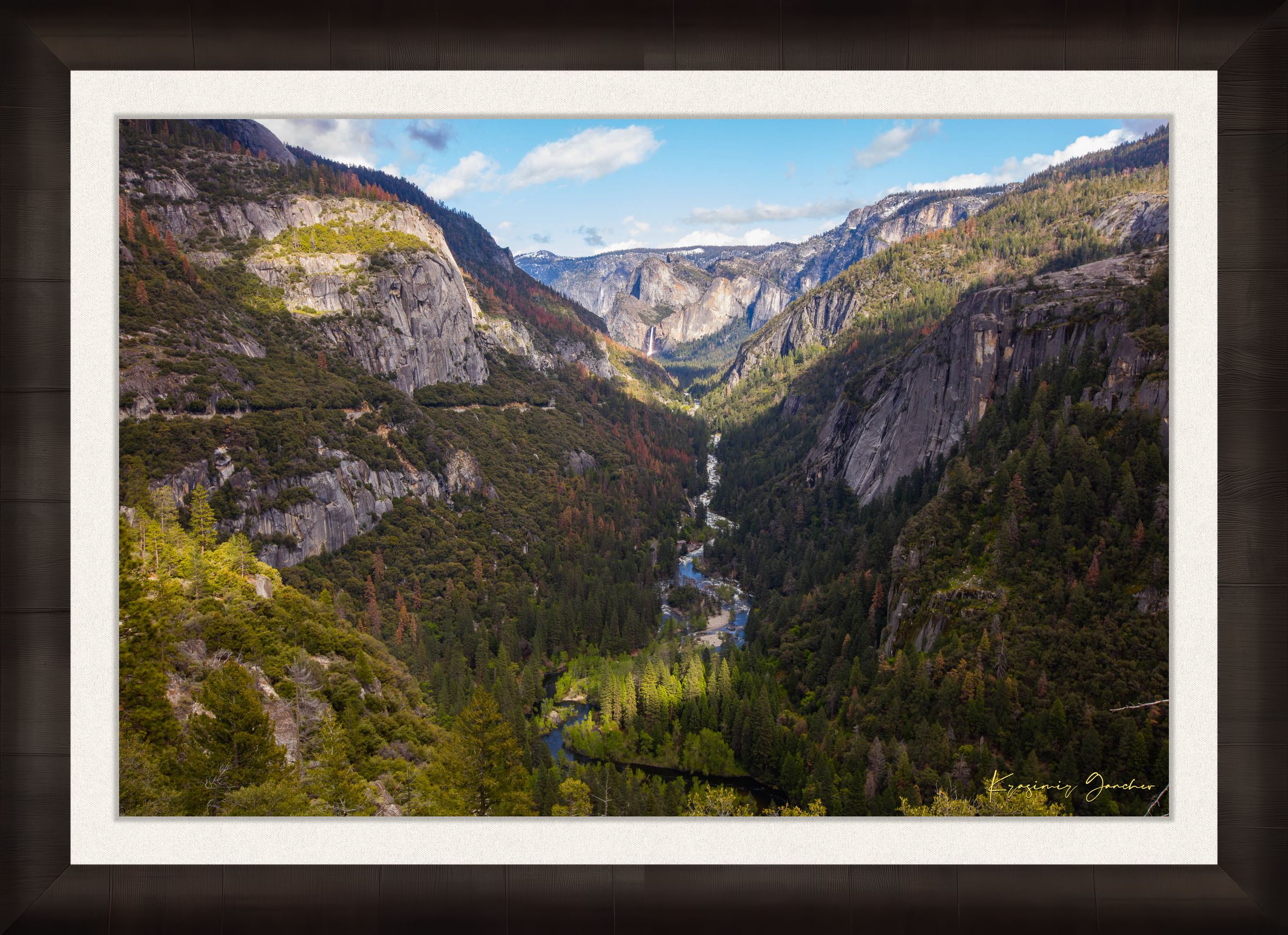 Merced River winding through a wooded valley in Yosemite National Park under daylight and soft evening sun with scattered clouds. #Finish_Roma Dark Ash Frame & Bright Liner