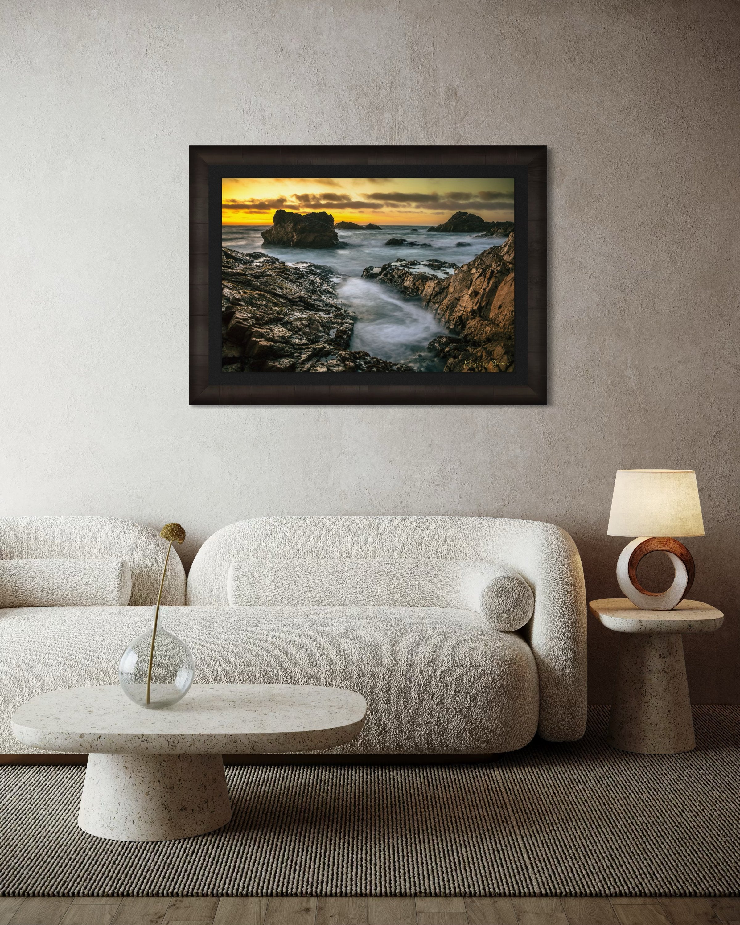 Jagged rocky cliffs along the Big Sur coast with rhythmic wave action, open ocean mist, clouds above, illuminated by late afternoon sunlight. #Finish_Roma Dark Ash Frame & Dark Liner