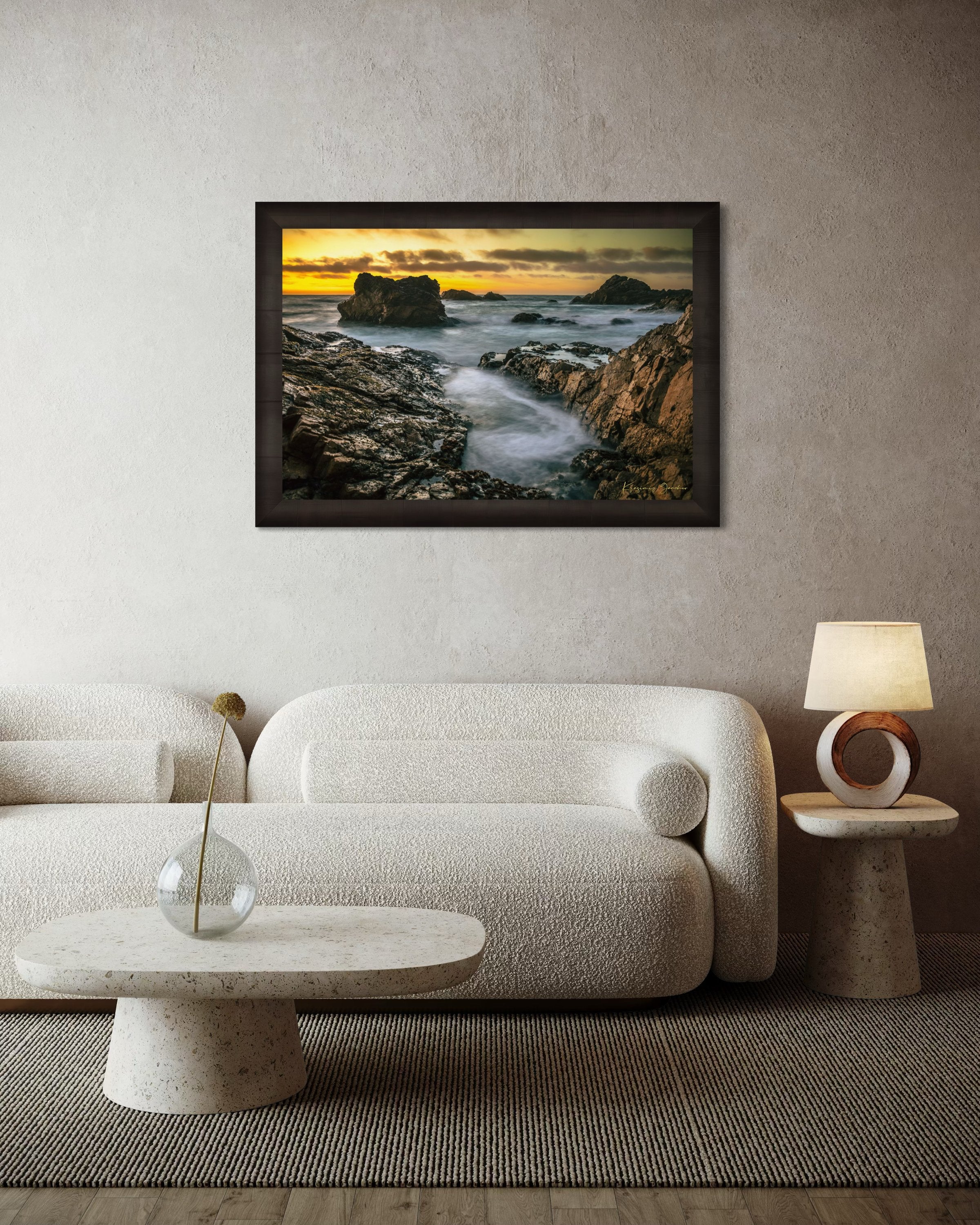 Jagged rocky cliffs along the Big Sur coast with rhythmic wave action, open ocean mist, clouds above, illuminated by late afternoon sunlight. #Finish_Roma Dark Ash Frame