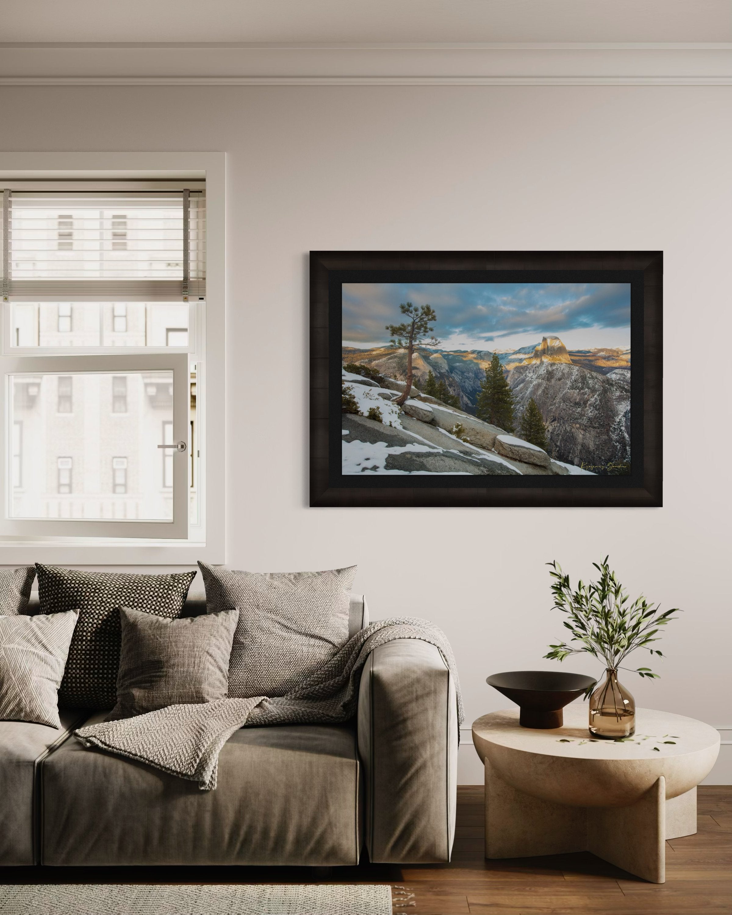 Majestic Half Dome in Yosemite National Park bathed in golden sunset light, covered in snow with wisps of cloud moving across the sky. #Finish_Roma Dark Ash Frame & Dark Liner