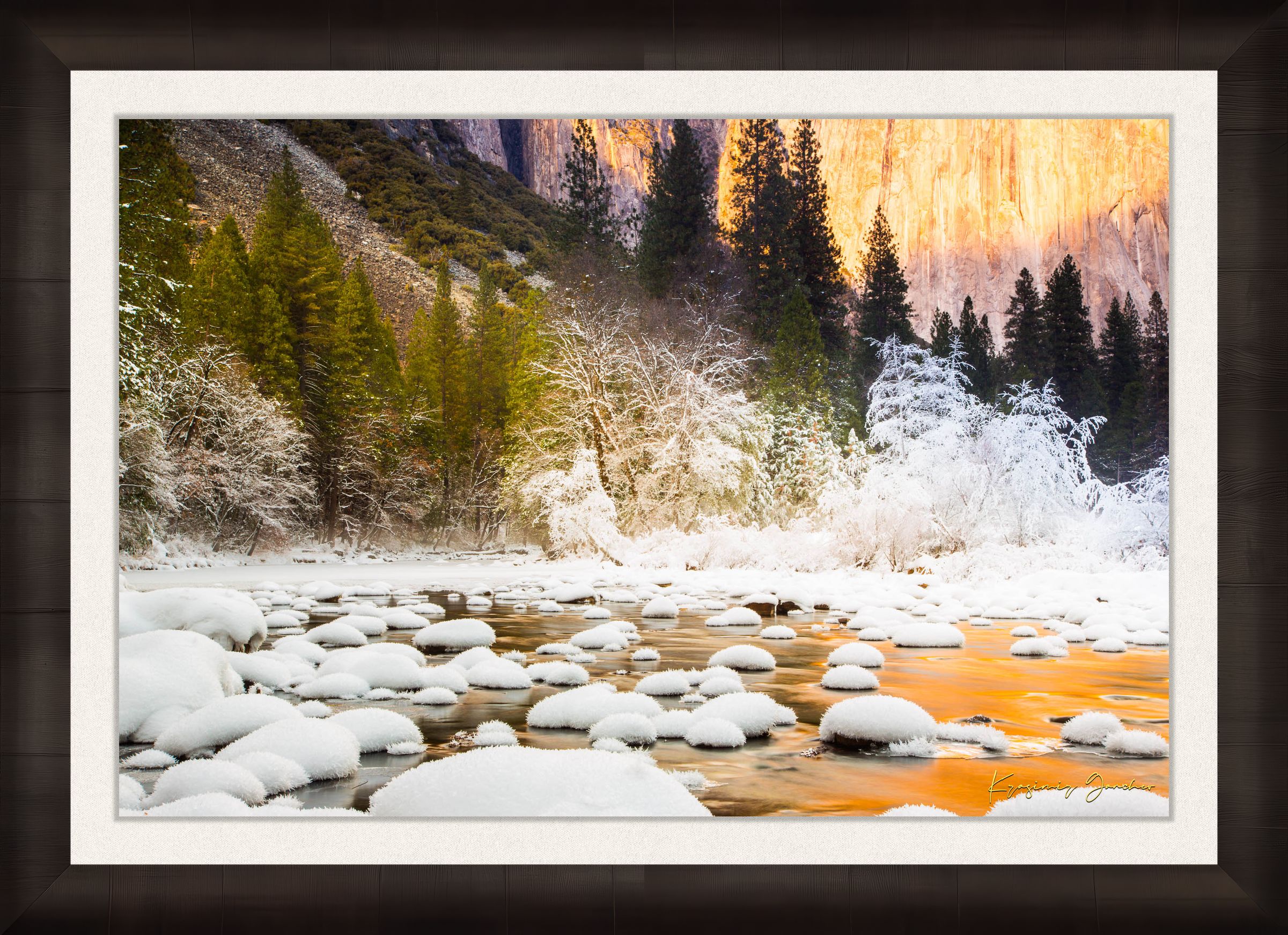 Merced River flowing through Yosemite National Park during sunset with golden light reflecting on snowy granite rock faces. #Finish_Roma Dark Ash Frame & Bright Liner