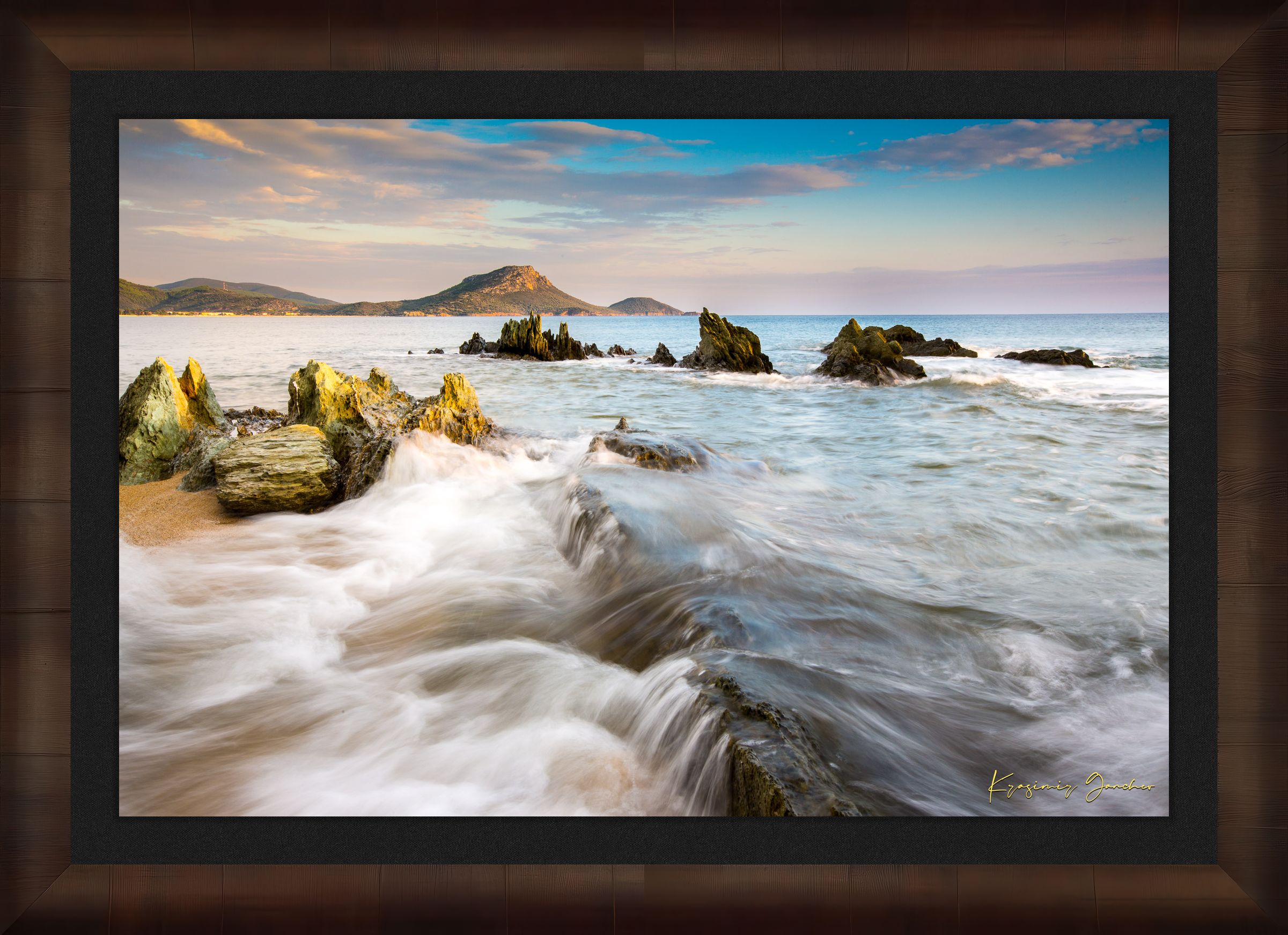 Sunset view of Sithonia's coastline featuring sea, rocky beach, scattered boulders, and gentle waves. #Finish_Roma Cigar Leaf Frame & Dark Liner