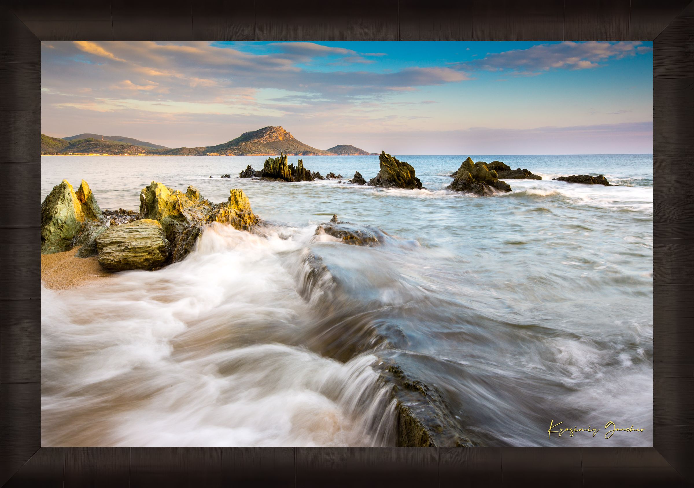 Sunset view of Sithonia's coastline featuring sea, rocky beach, scattered boulders, and gentle waves. #Finish_Roma Dark Ash Frame