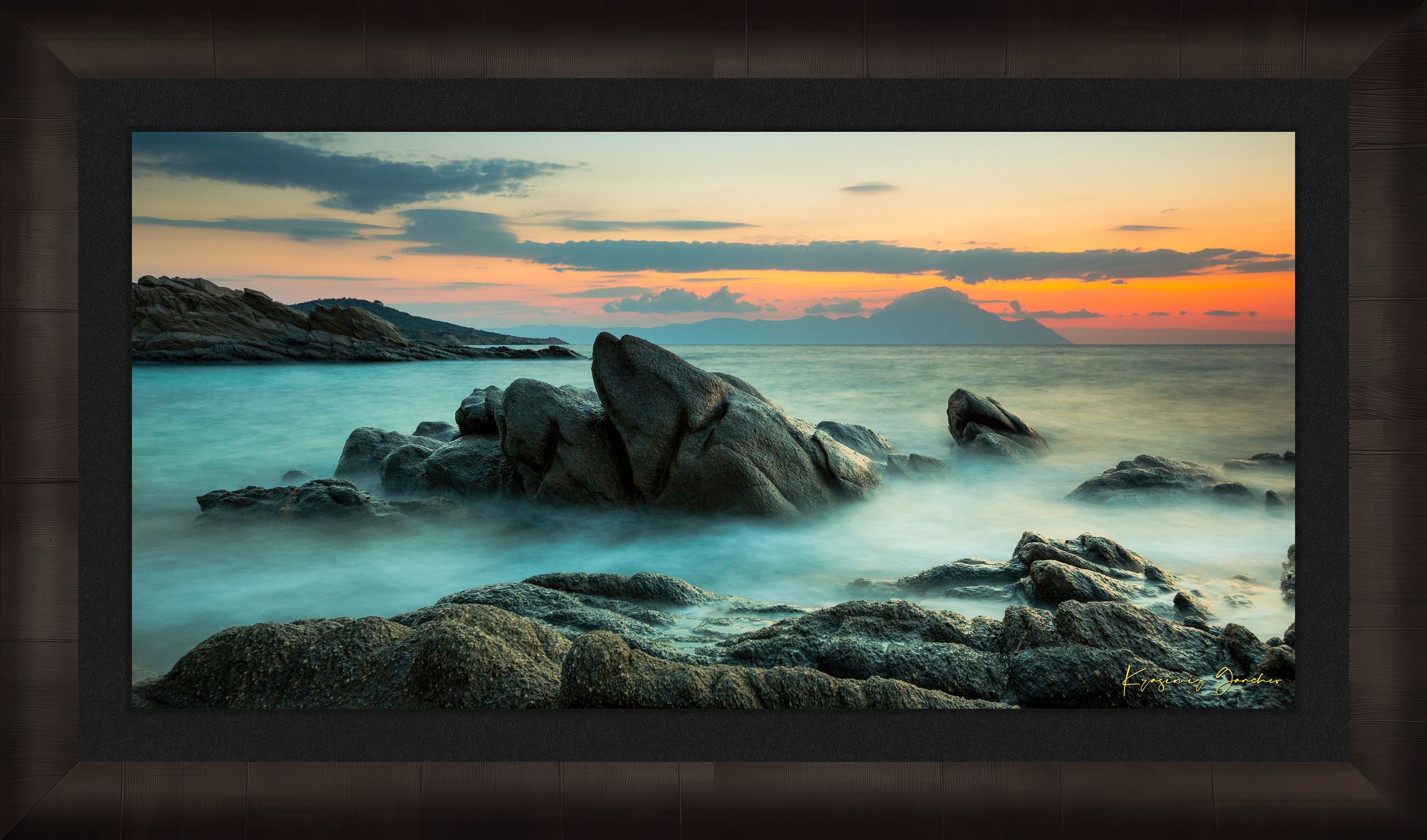Sunrise long exposure at Sarti featuring coastal rock formations, sea stacks, cloud-covered sky, and soft waves. #Finish_Roma Dark Ash Frame & Dark Liner