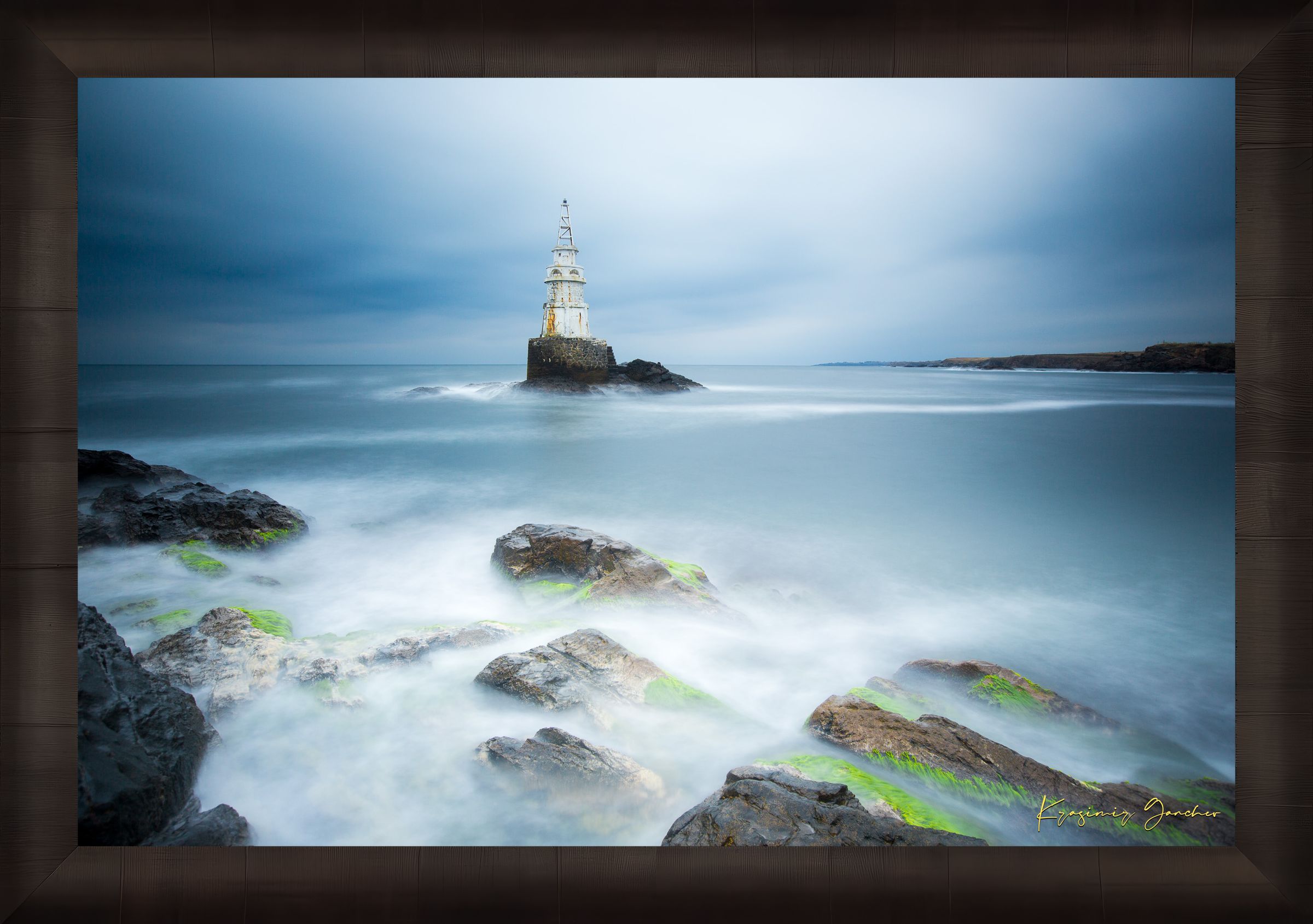 Lighthouse in Ahtopol during dusk with rocky coastal terrain, turbulent waves, and stormy skies. #Finish_Roma Dark Ash Frame