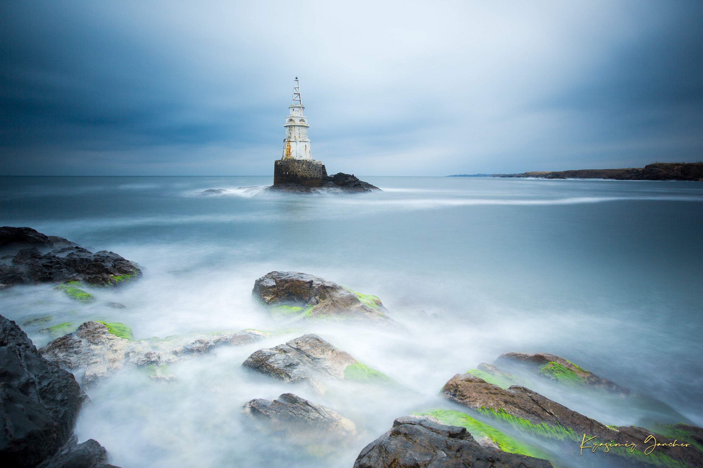 Lighthouse in Ahtopol during dusk with rocky coastal terrain, turbulent waves, and stormy skies. #Finish_Acrylic Recess