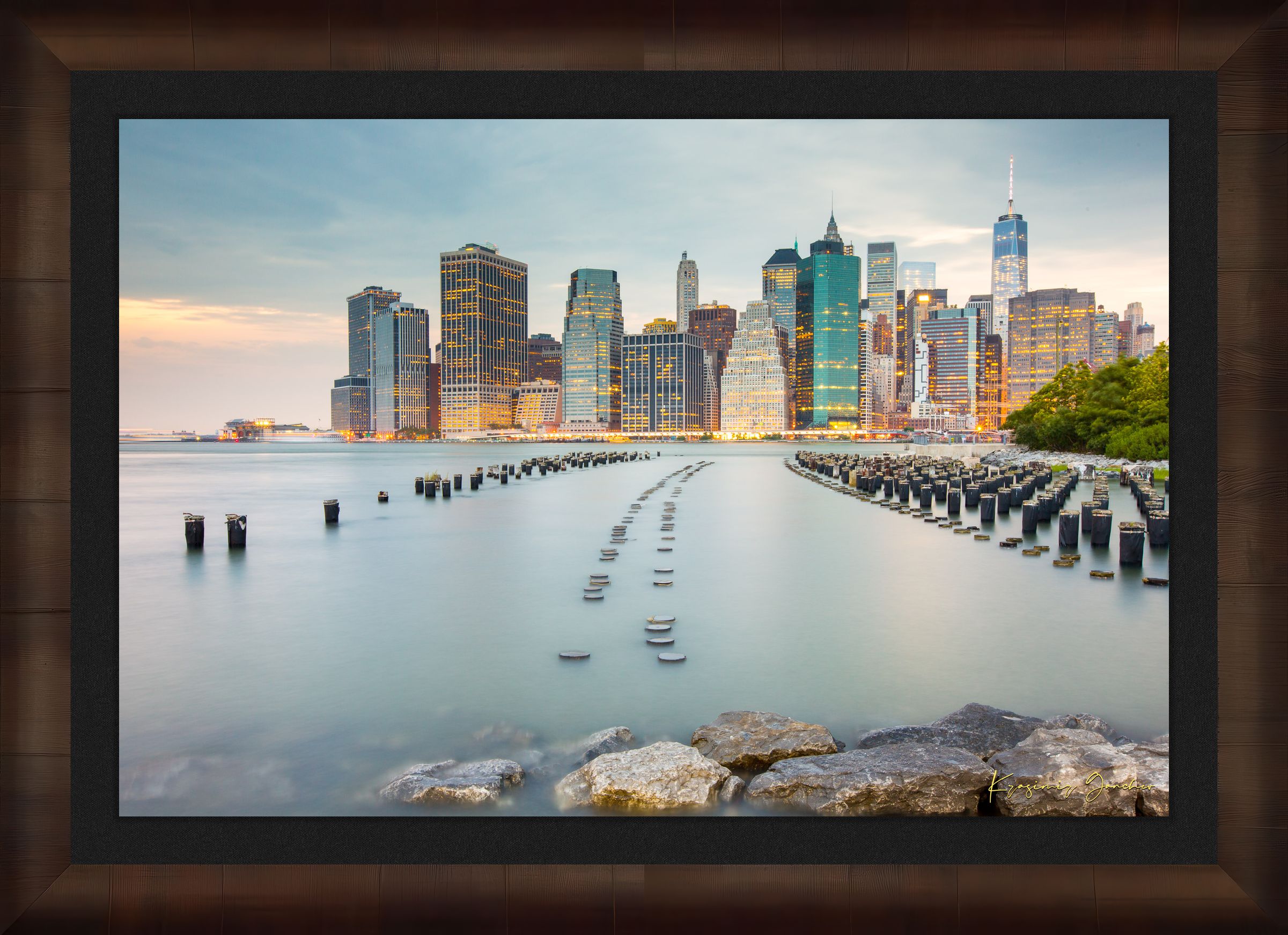 Urban waterfront scene along an estuary in Manhattan under a twilight sky with clouds and reflected city lights. #Finish_Roma Cigar Leaf Frame & Dark Liner