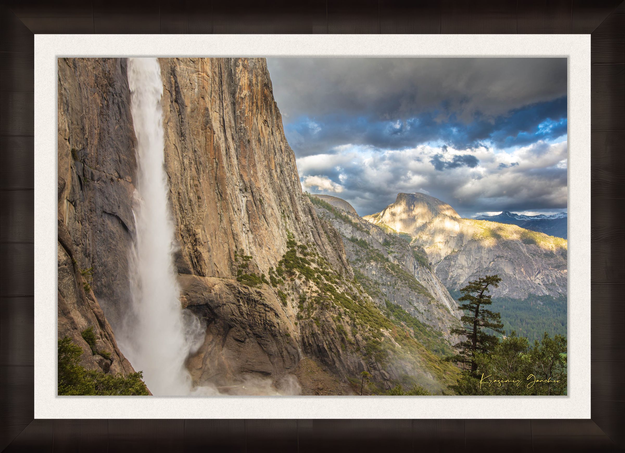 Half Dome illuminated by sunset light through dense storm clouds with waterfall below. #Finish_Roma Dark Ash Frame & Bright Liner