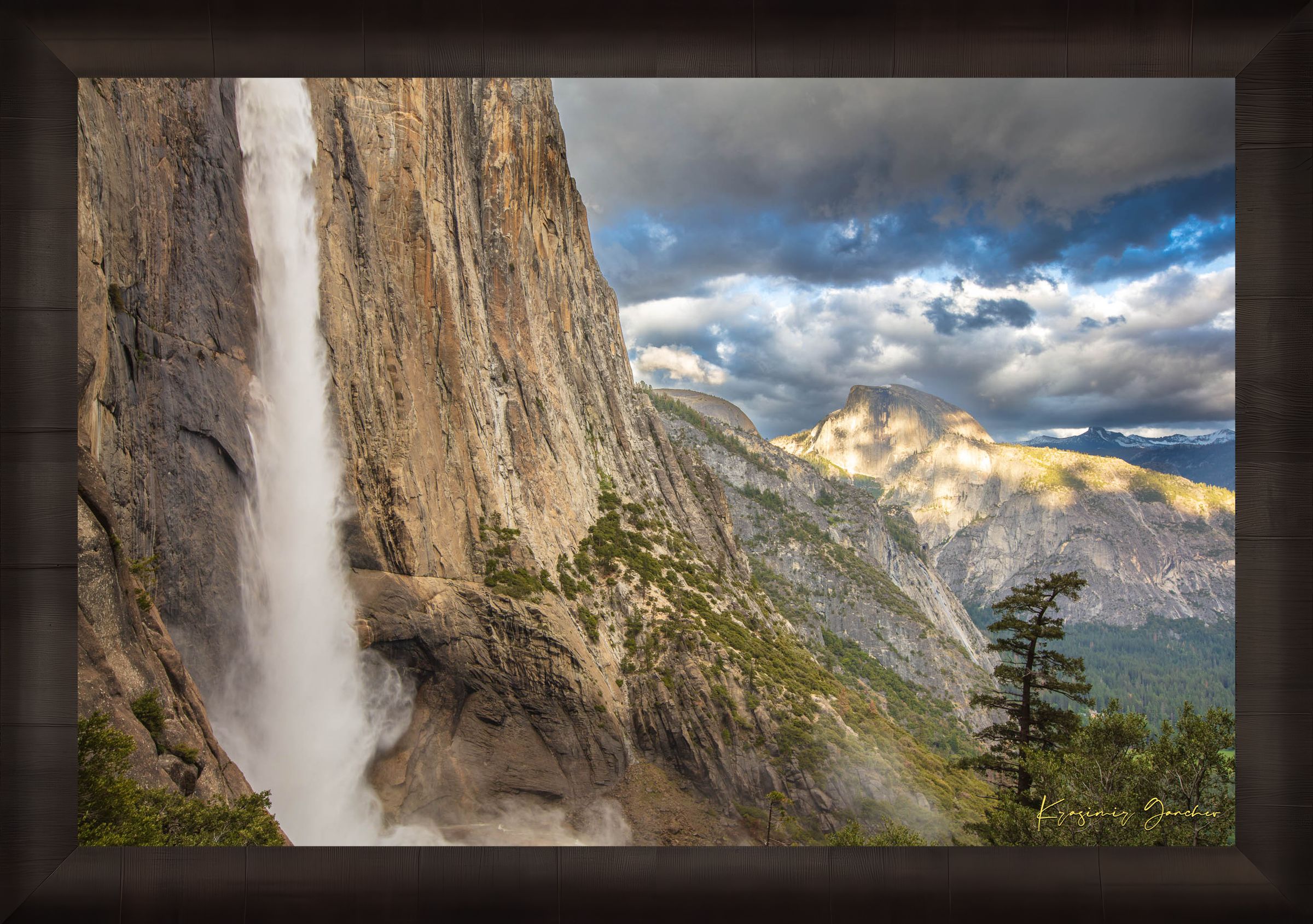 Half Dome illuminated by sunset light through dense storm clouds with waterfall below. #Finish_Roma Dark Ash Frame