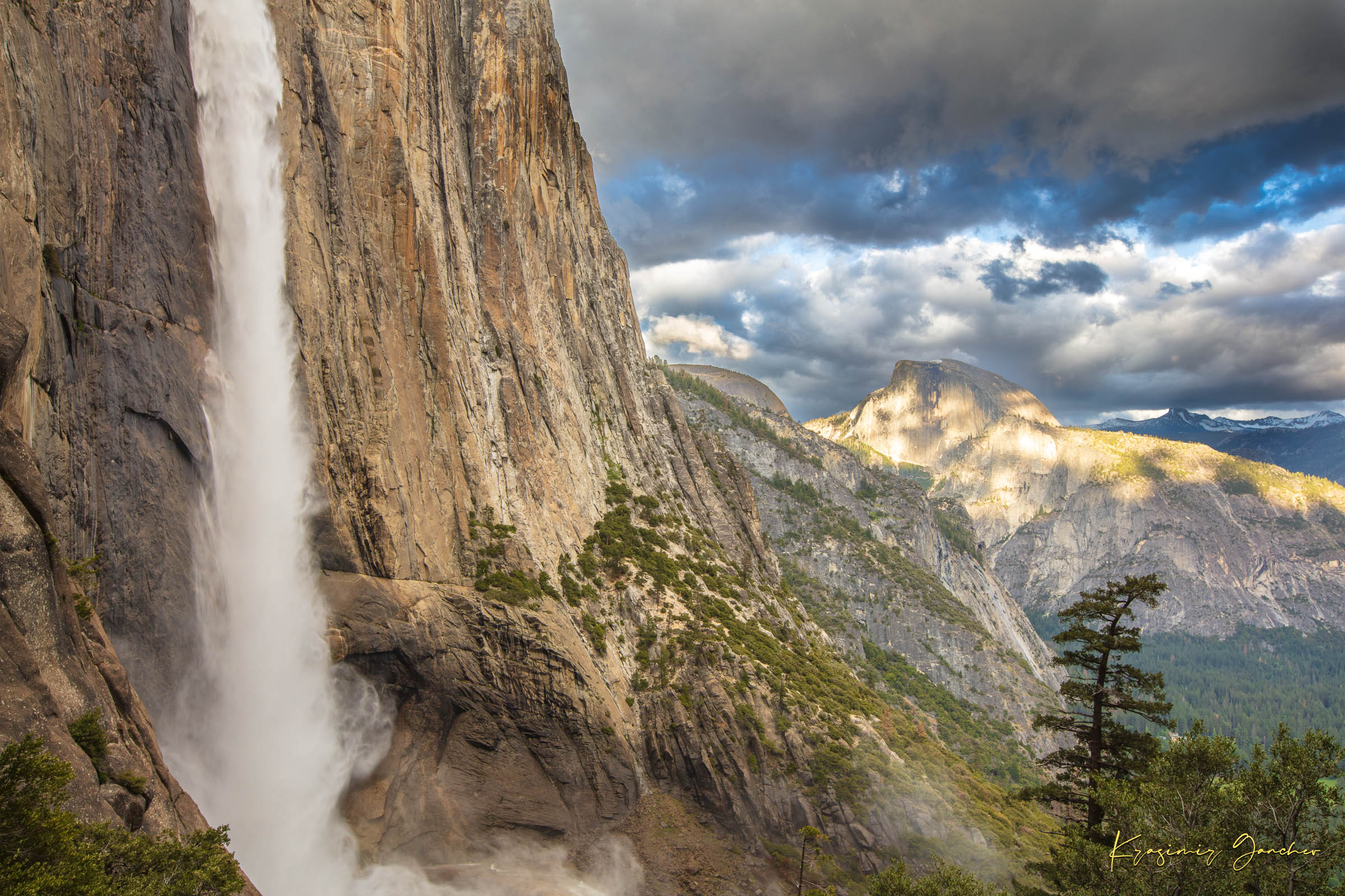 Half Dome illuminated by sunset light through dense storm clouds with waterfall below. #Finish_Acrylic Recess