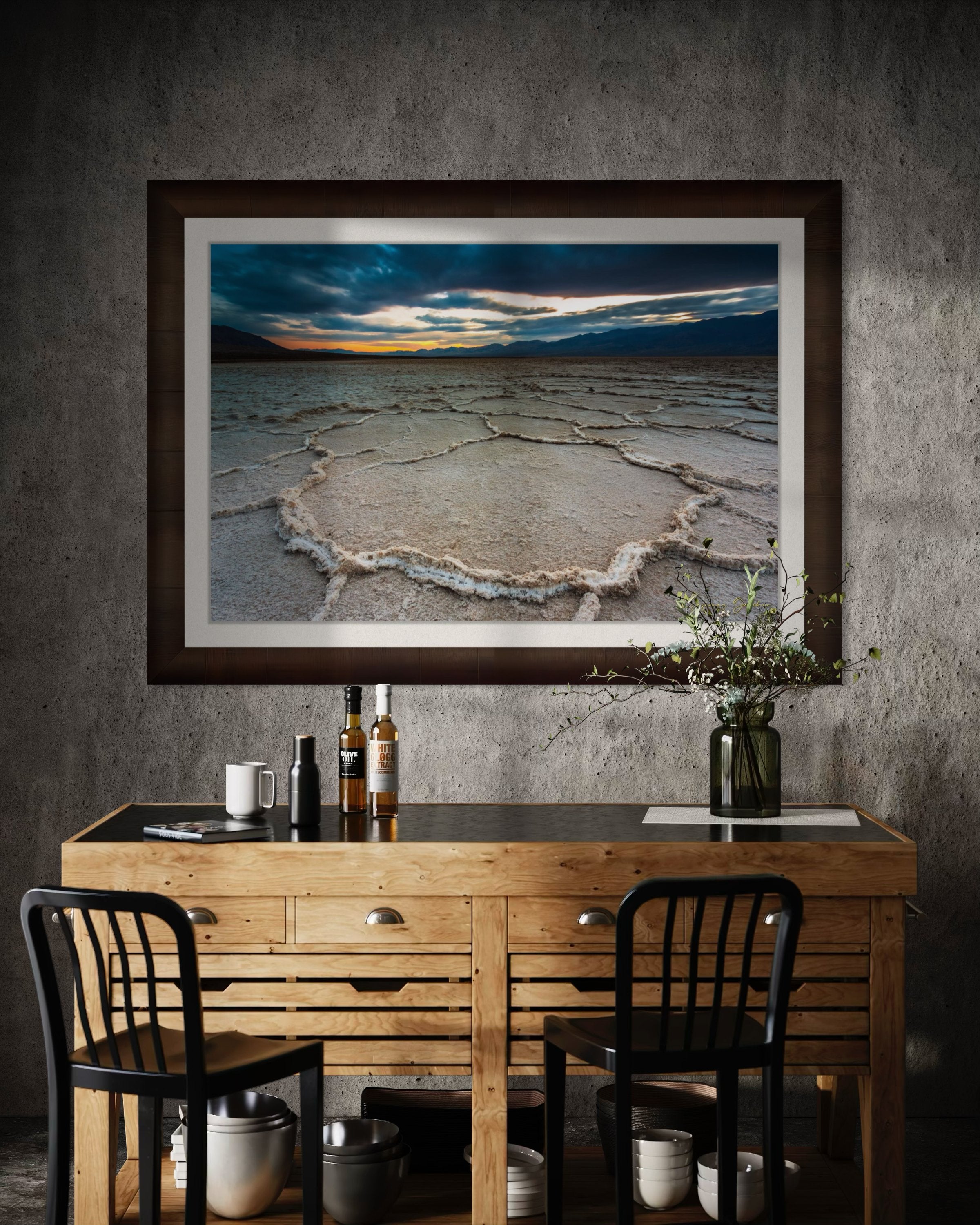 Expansive desert salt flat of Badwater Basin beneath a sky filled with storm clouds and setting sun in Death Valley. #Finish_Roma Cigar Leaf Frame & Bright Liner