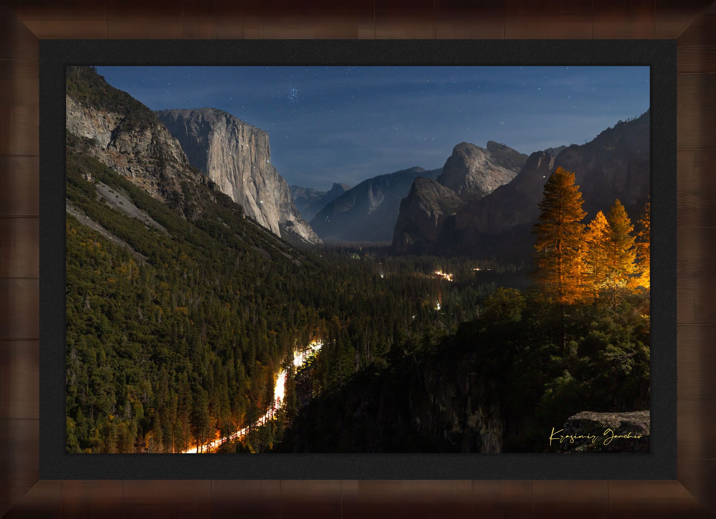 El Capitan at night in Yosemite Valley, moonlight revealing climbing gear and waterfall with clouds above, serene wilderness scene. #Finish_Roma Cigar Leaf Frame & Dark Liner