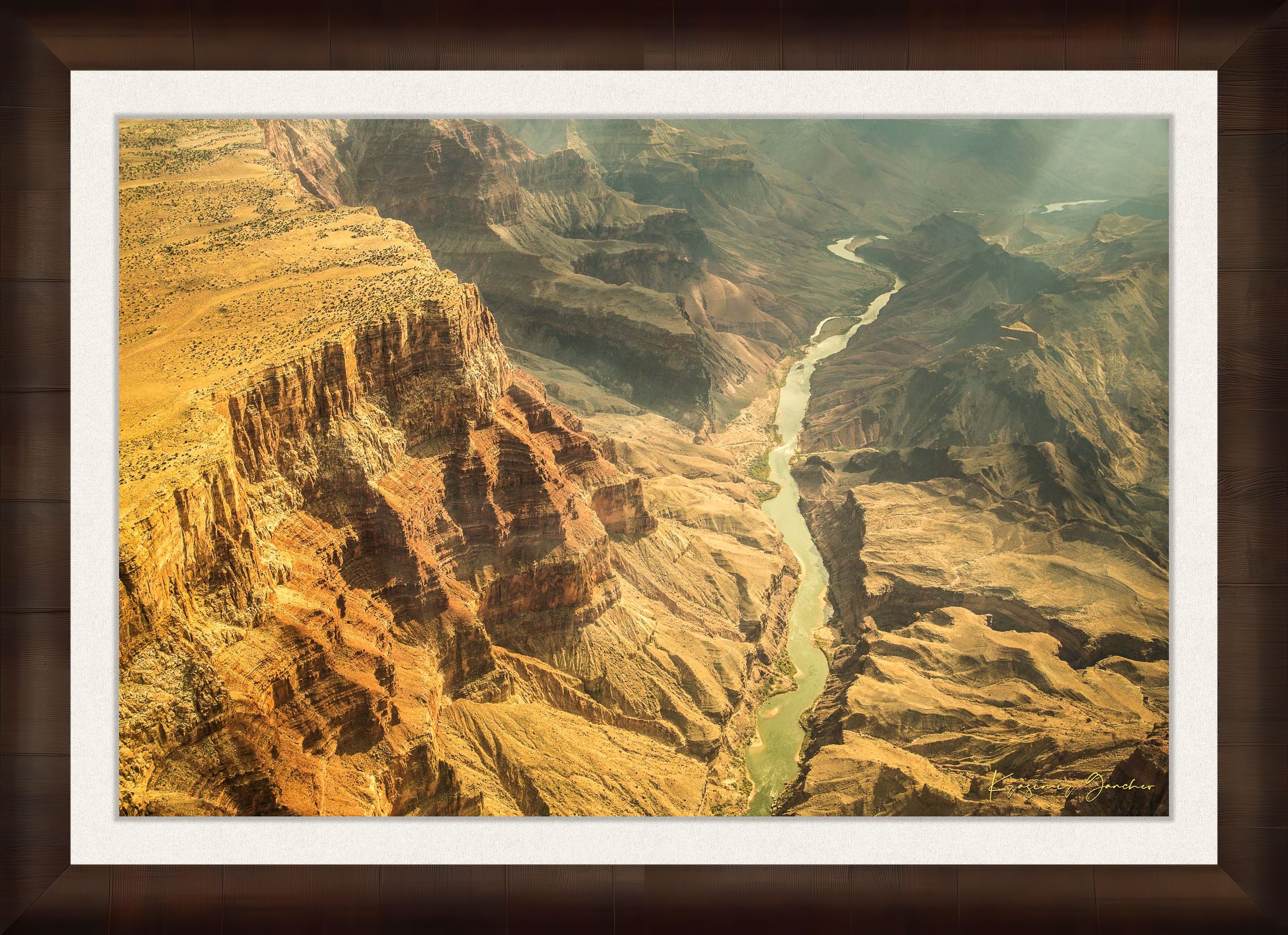 Colorado River traversing the Grand Canyon chasm in daylight, visible geological formations shrouded in haze. #Finish_Roma Cigar Leaf Frame & Bright Liner