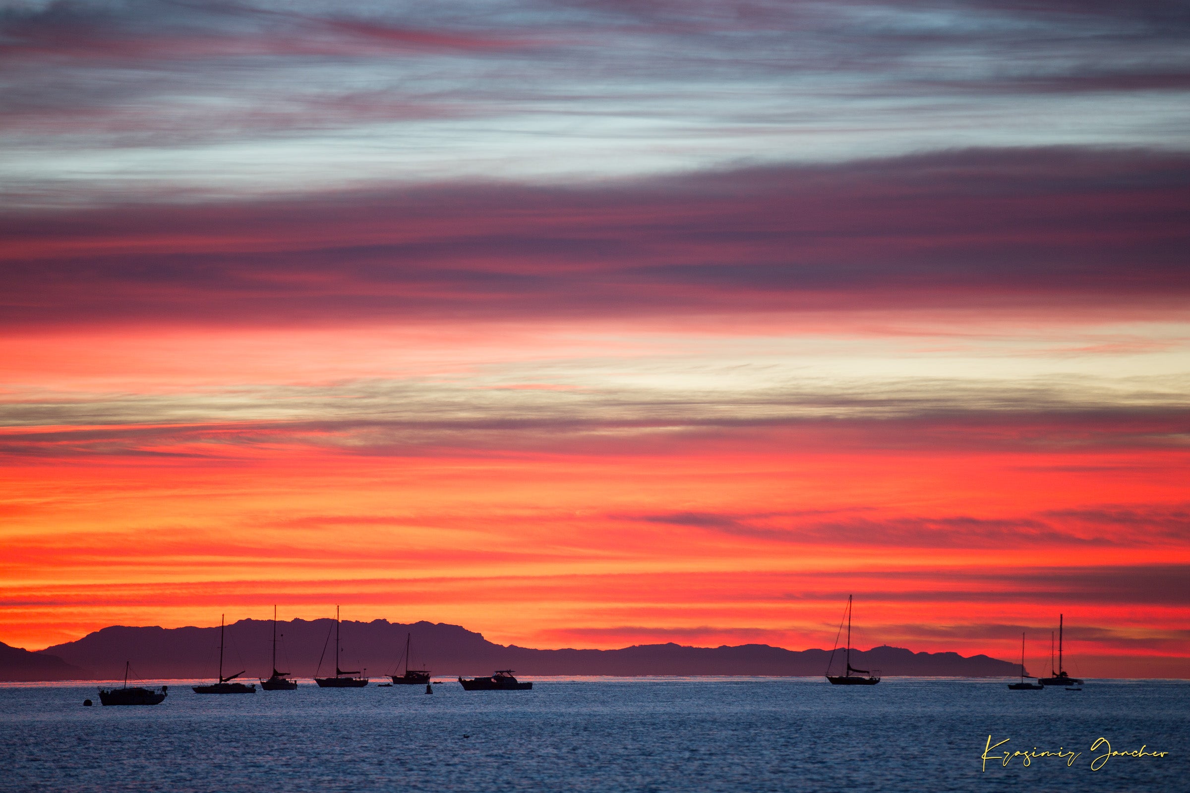 East Beach along the coastal landscape of Santa Barbara, California, during sunset with boats silhouetted on the horizon. #Finish_Acrylic Recess