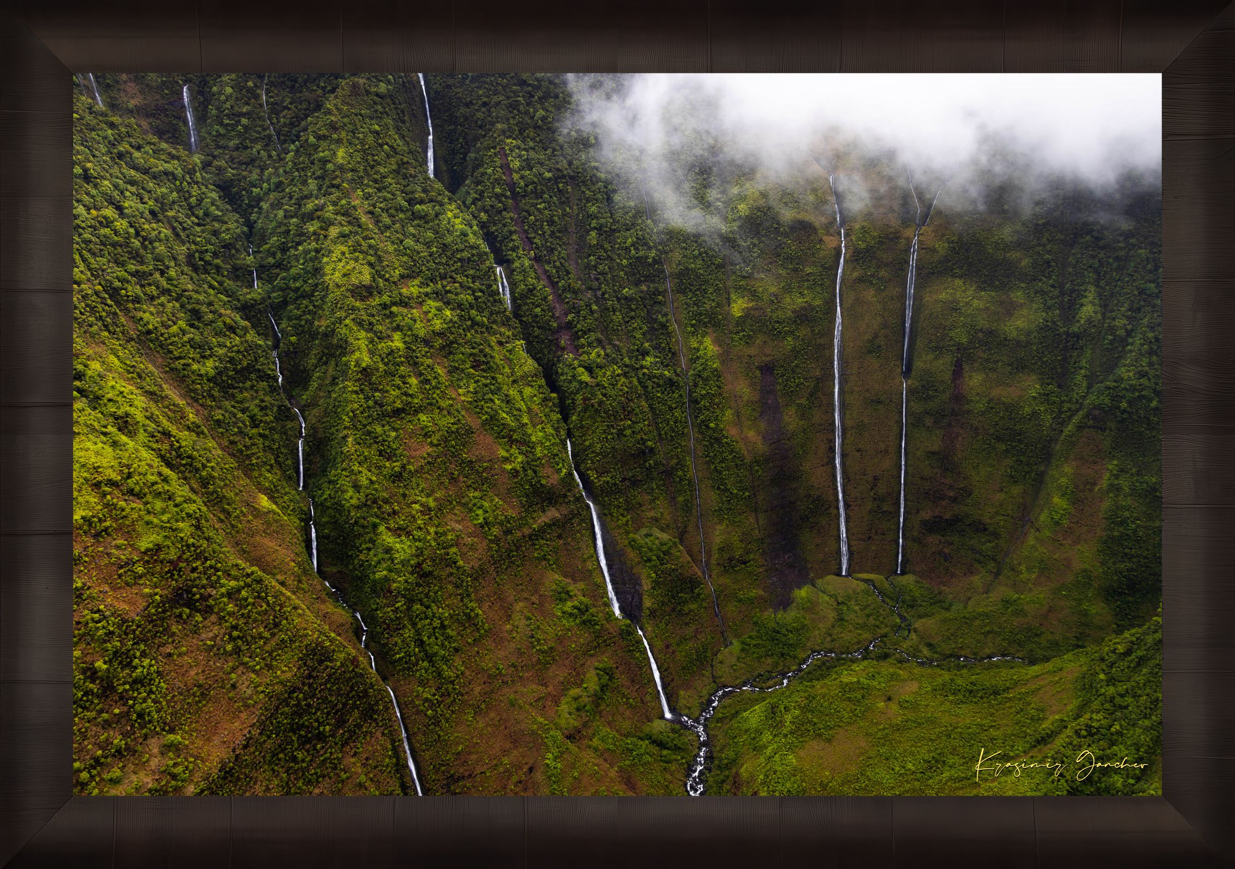 Waterfall cascading down a cliff in the Weeping Wall region, Kauai, under daytime light and cloud cover. #Finish_Roma Dark Ash Frame