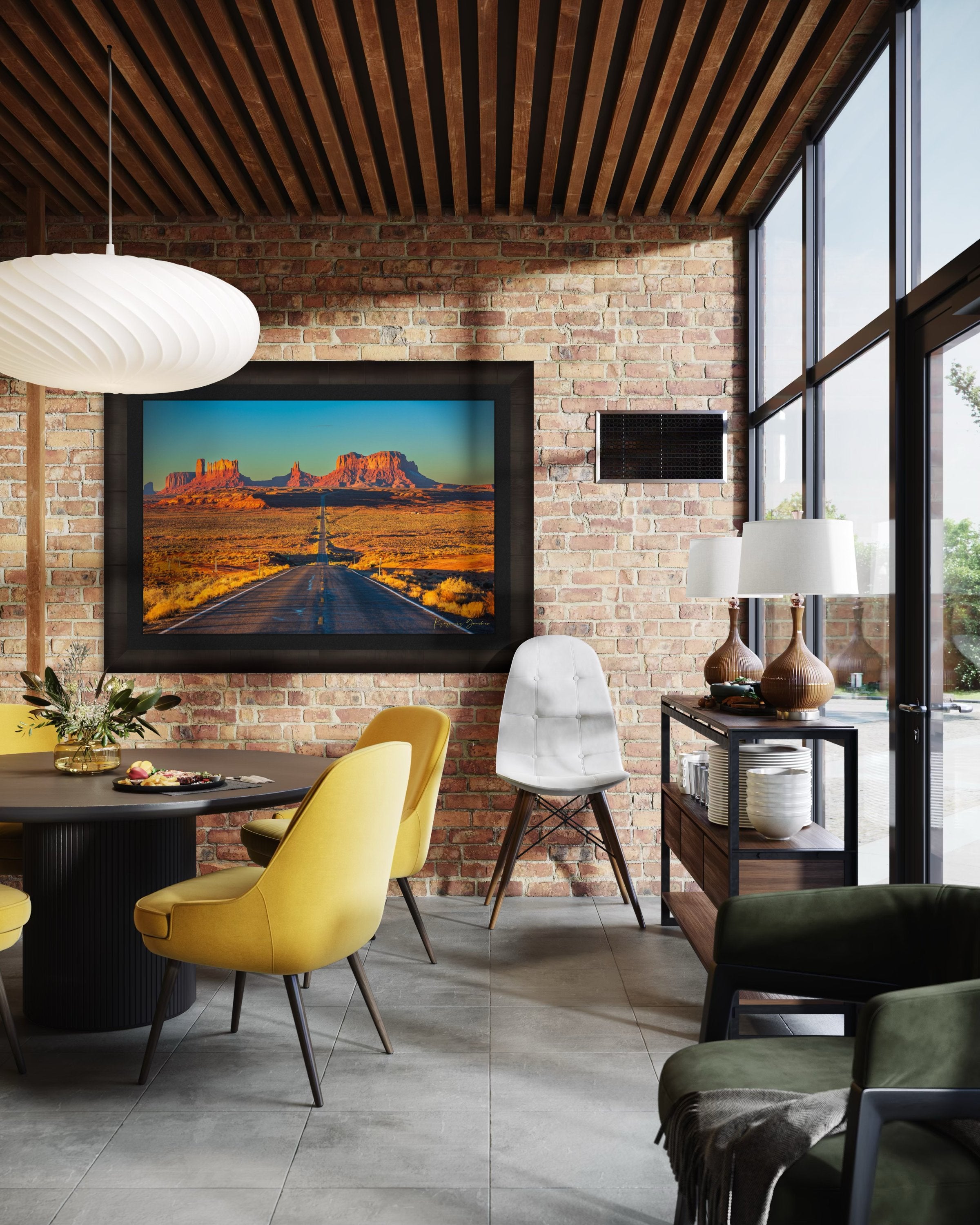 A winding road leads toward distant mesas under a hazy sky in Monument Valley, bathed in warm daylight and soft morning light. #Finish_Roma Dark Ash Frame & Dark Liner