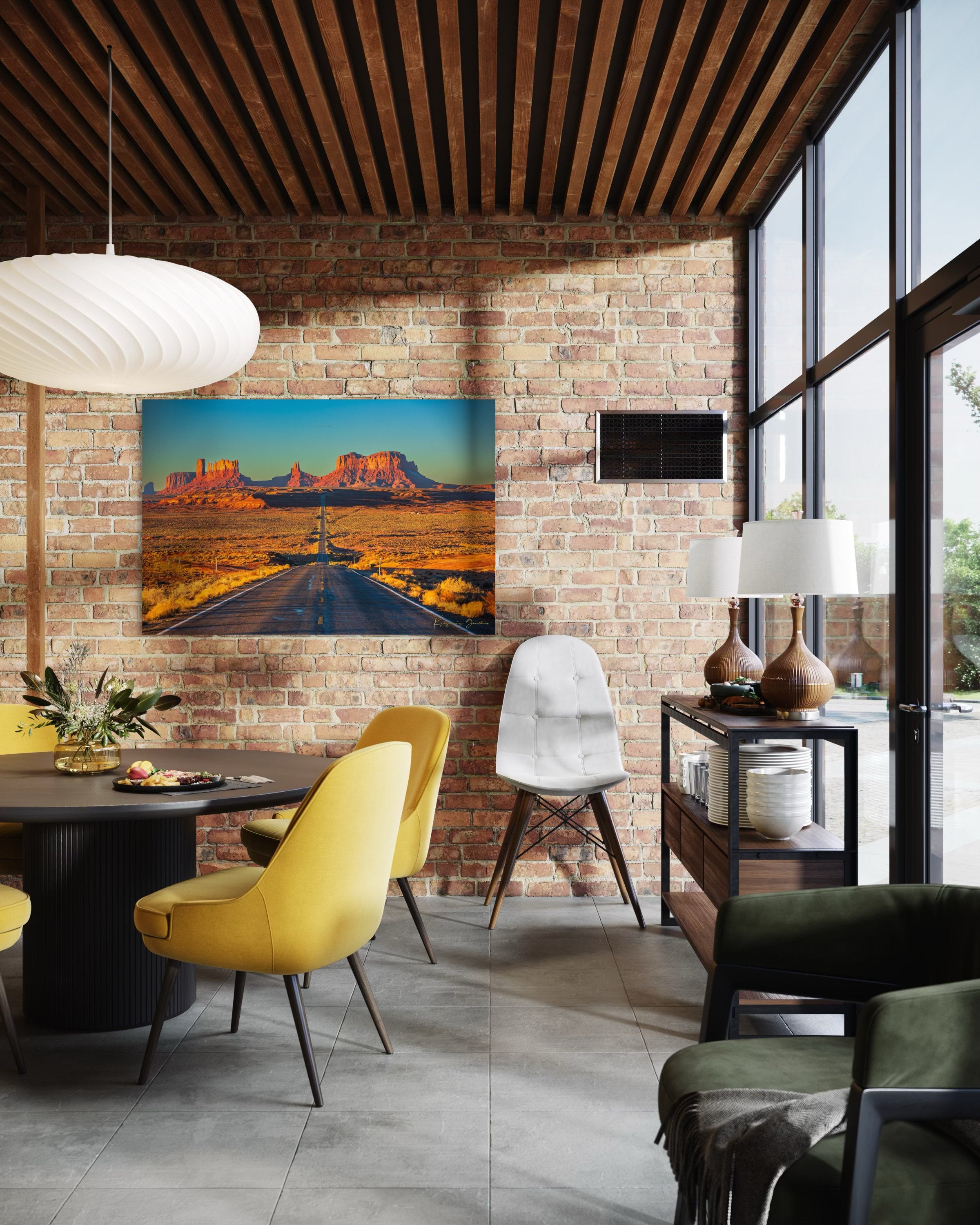 A winding road leads toward distant mesas under a hazy sky in Monument Valley, bathed in warm daylight and soft morning light. #Finish_Acrylic Recess