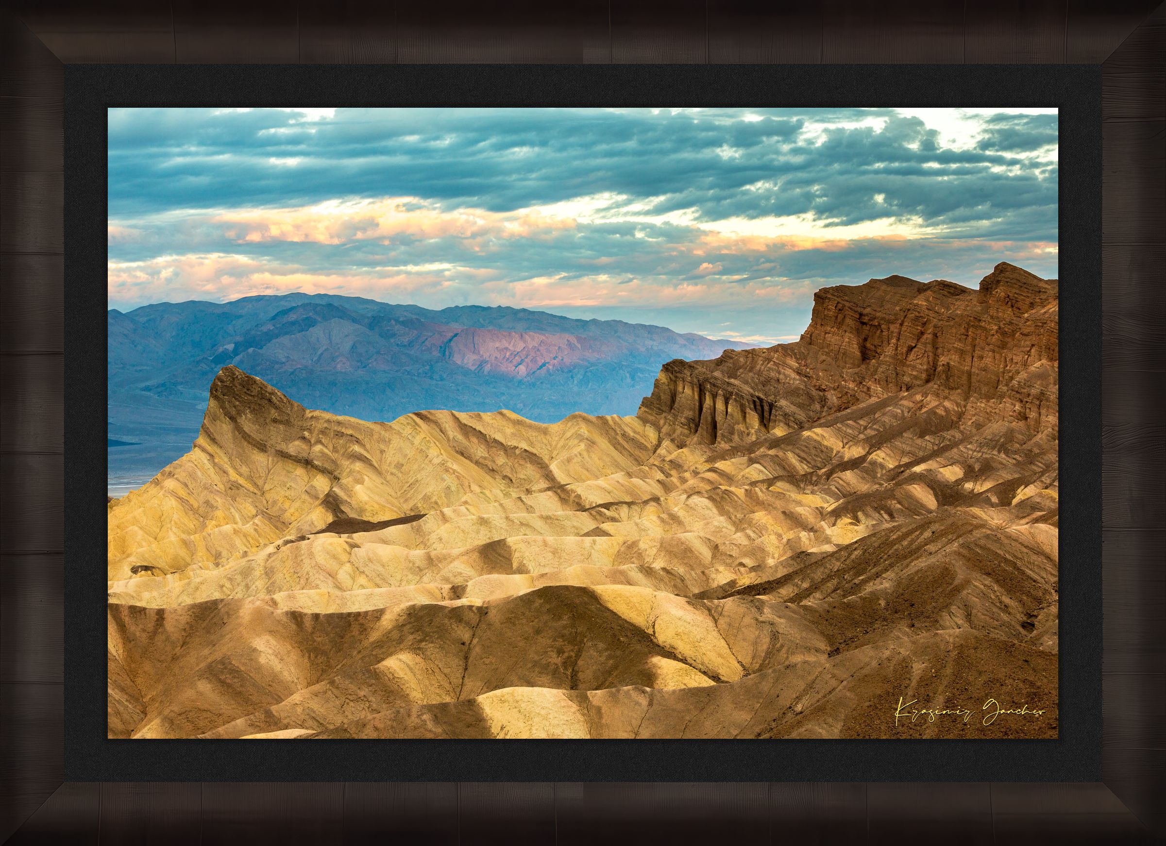 Layered sandstone and sedimentary rock layers at Zabriskie Point, Death Valley National Park, under morning sunlight. #Finish_Roma Dark Ash Frame & Dark Liner