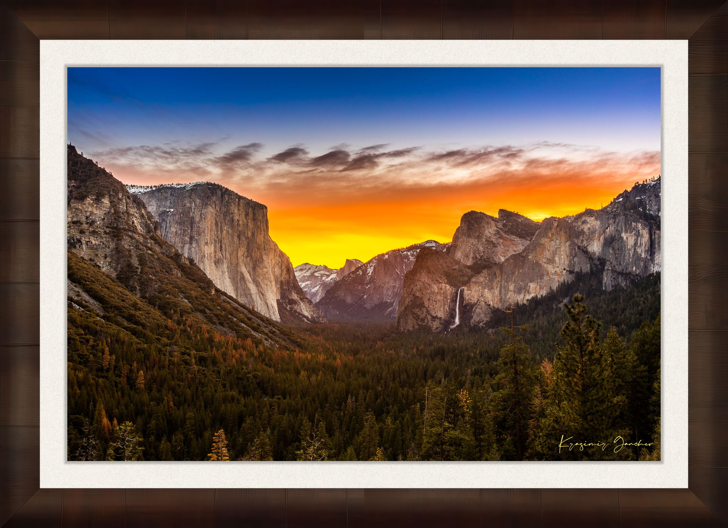 El Capitan rising above Yosemite Valley at sunrise, sunlit peaks framed by layered clouds. #Finish_Roma Cigar Leaf Frame & Bright Liner
