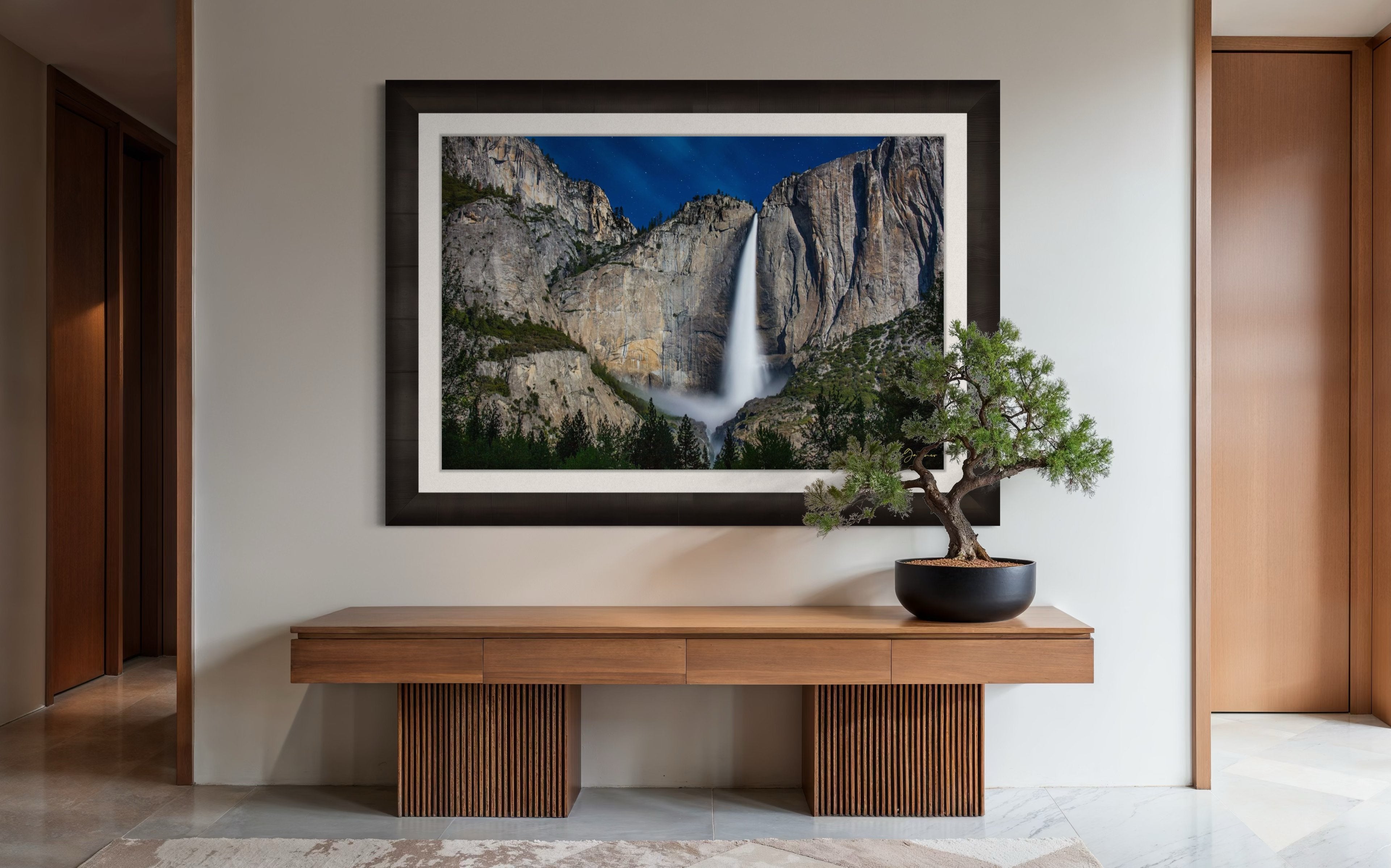 Upper Yosemite Falls illuminated by moonlight against a dark mountainous backdrop at night with cloud cover. #Finish_Roma Dark Ash Frame & Bright Liner