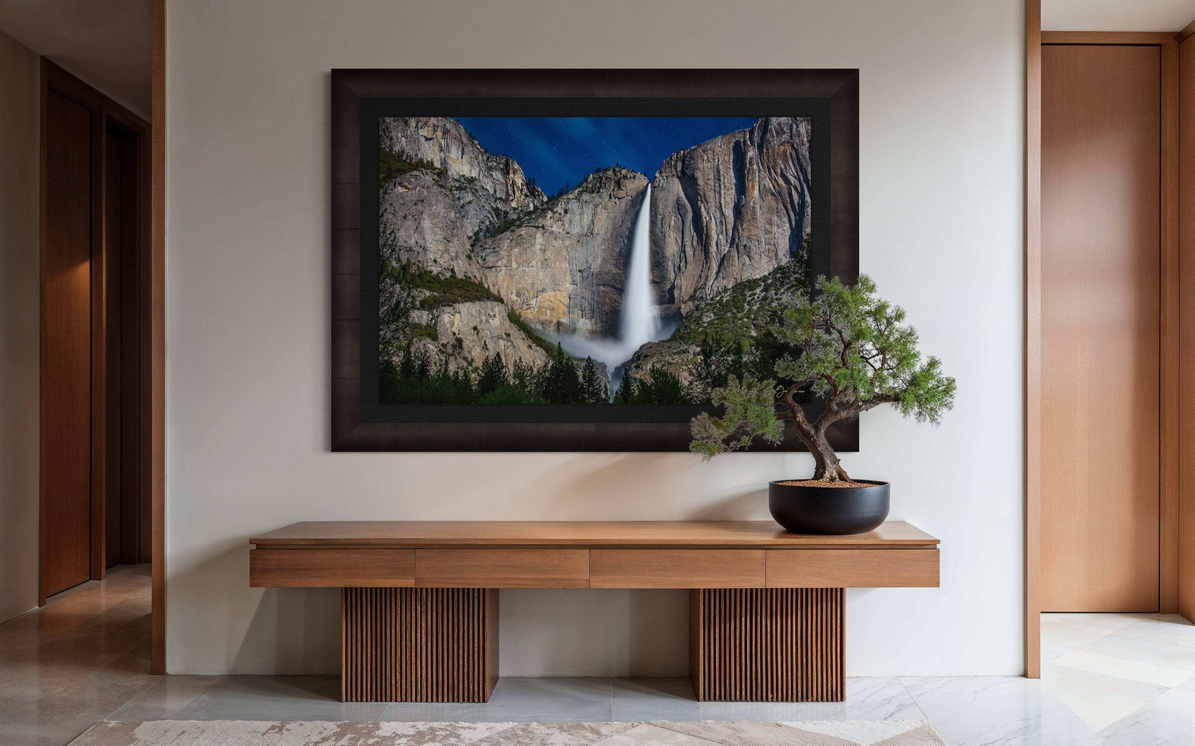 Upper Yosemite Falls illuminated by moonlight against a dark mountainous backdrop at night with cloud cover. #Finish_Roma Dark Ash Frame & Dark Liner