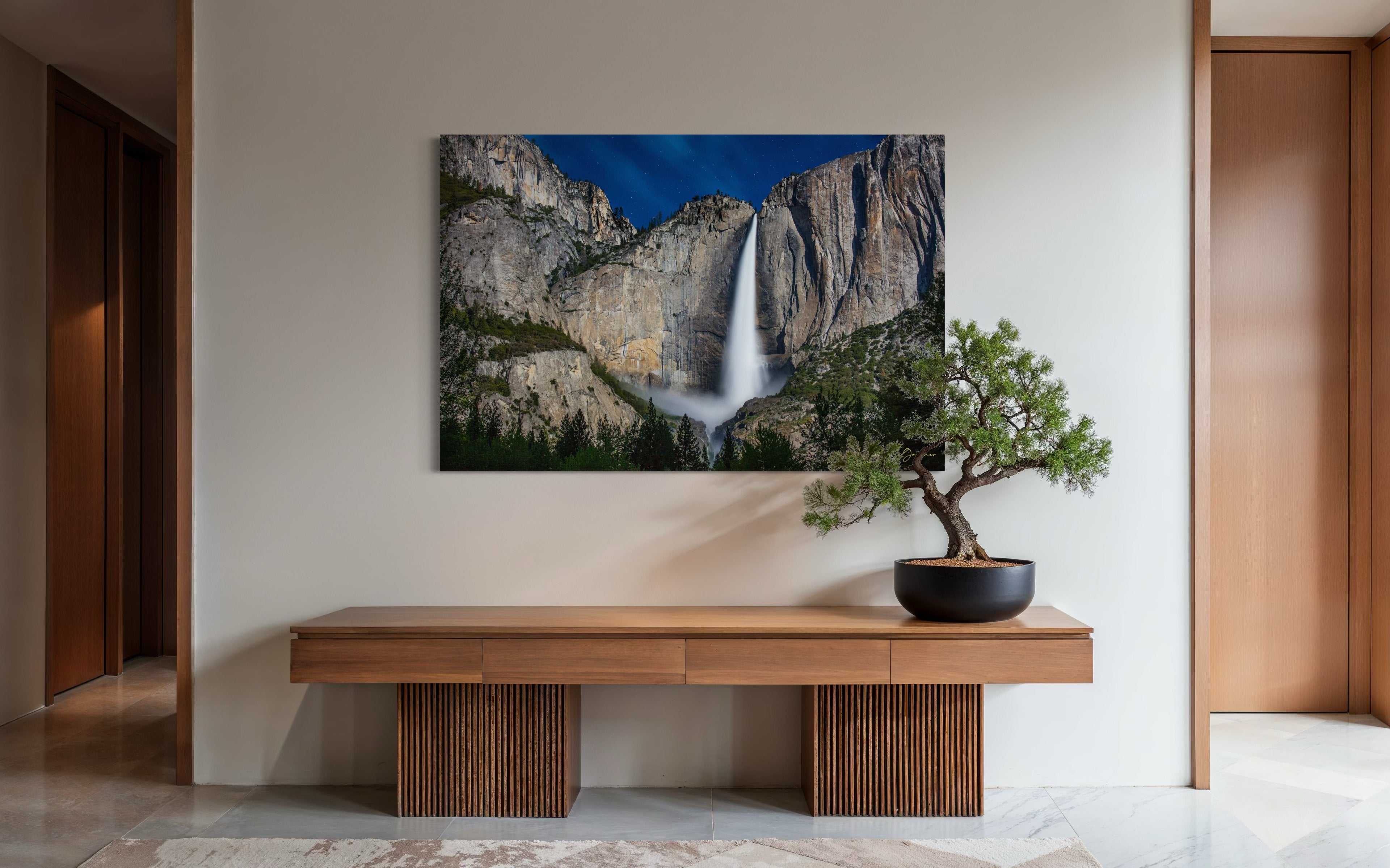 Upper Yosemite Falls illuminated by moonlight against a dark mountainous backdrop at night with cloud cover. #Finish_Acrylic Recess