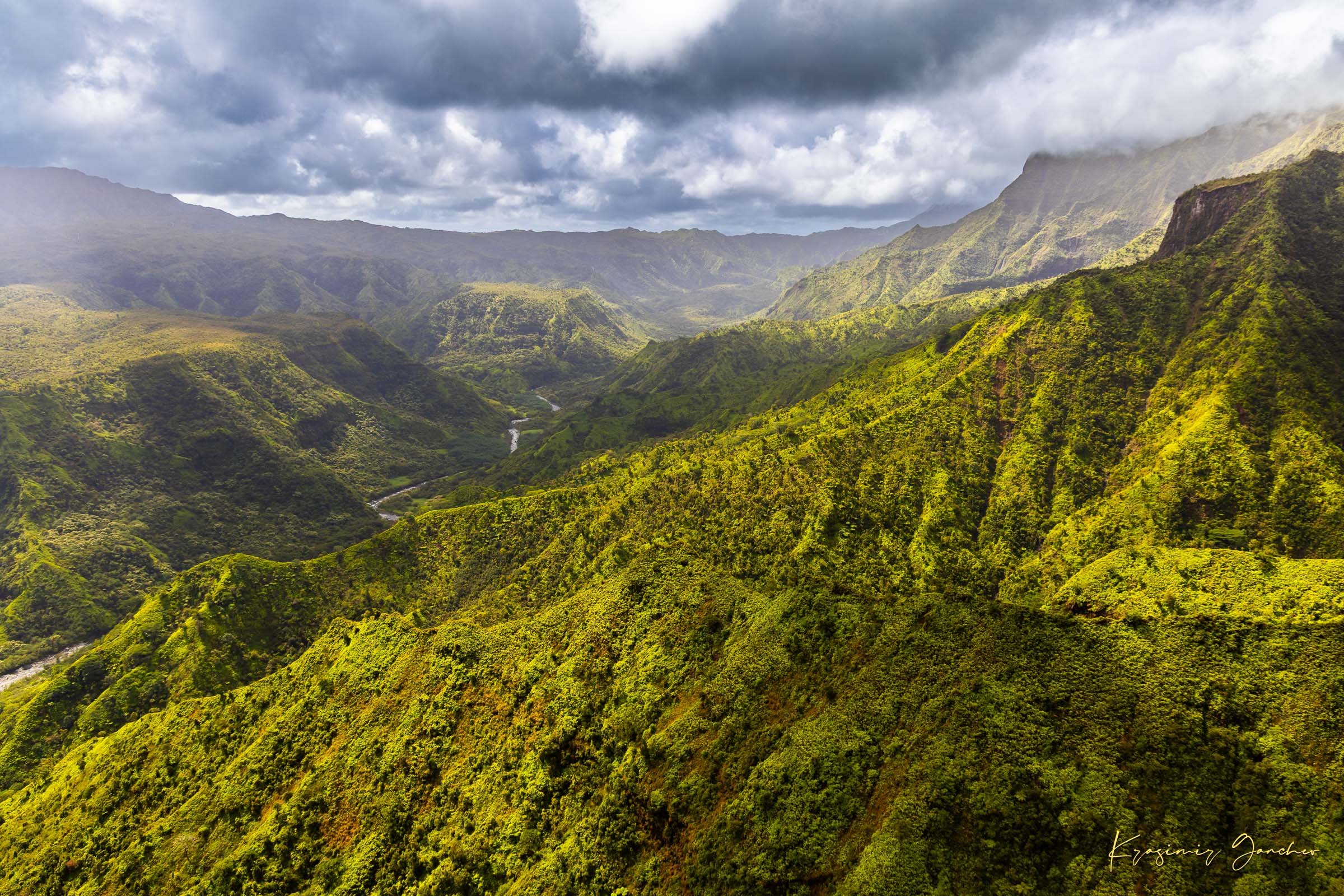 Expansive aerial view of a mountainous valley in Kauai illuminated by daylight, covered in low-lying cloud. #Finish_Acrylic Recess