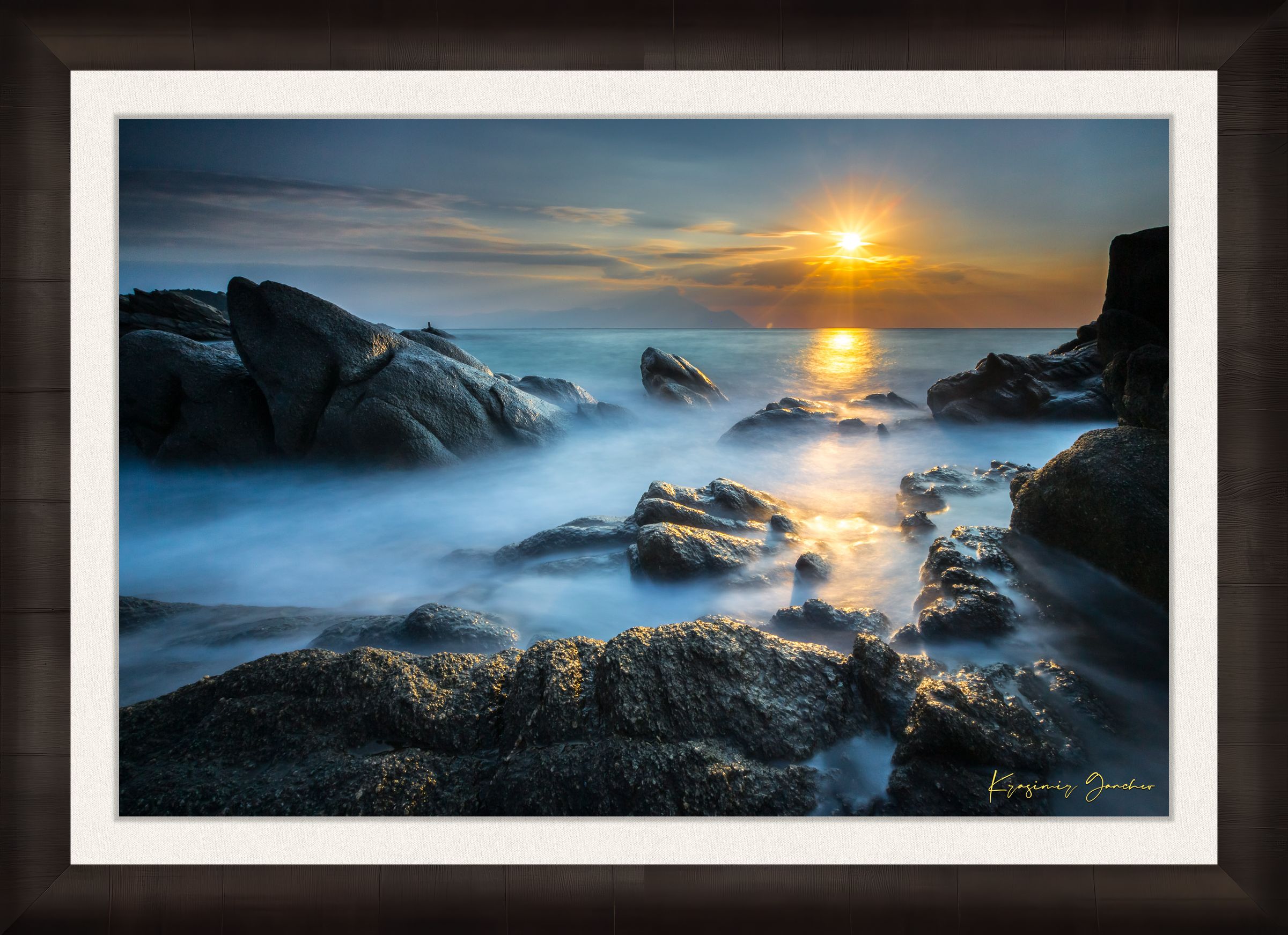 Coastal rocks with a sea stack at sunrise, soft light on the moving sea surface. Taken in Sarti, Greece. #Finish_Roma Dark Ash Frame & Bright Liner