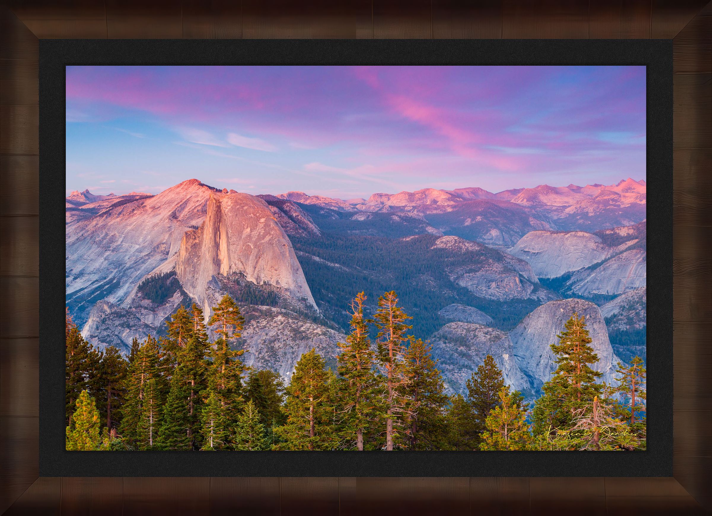 Granite monolith of Half Dome silhouetted against colorful sunset skies over Yosemite National Park with cloud layers. #Finish_Roma Cigar Leaf Frame & Dark Liner