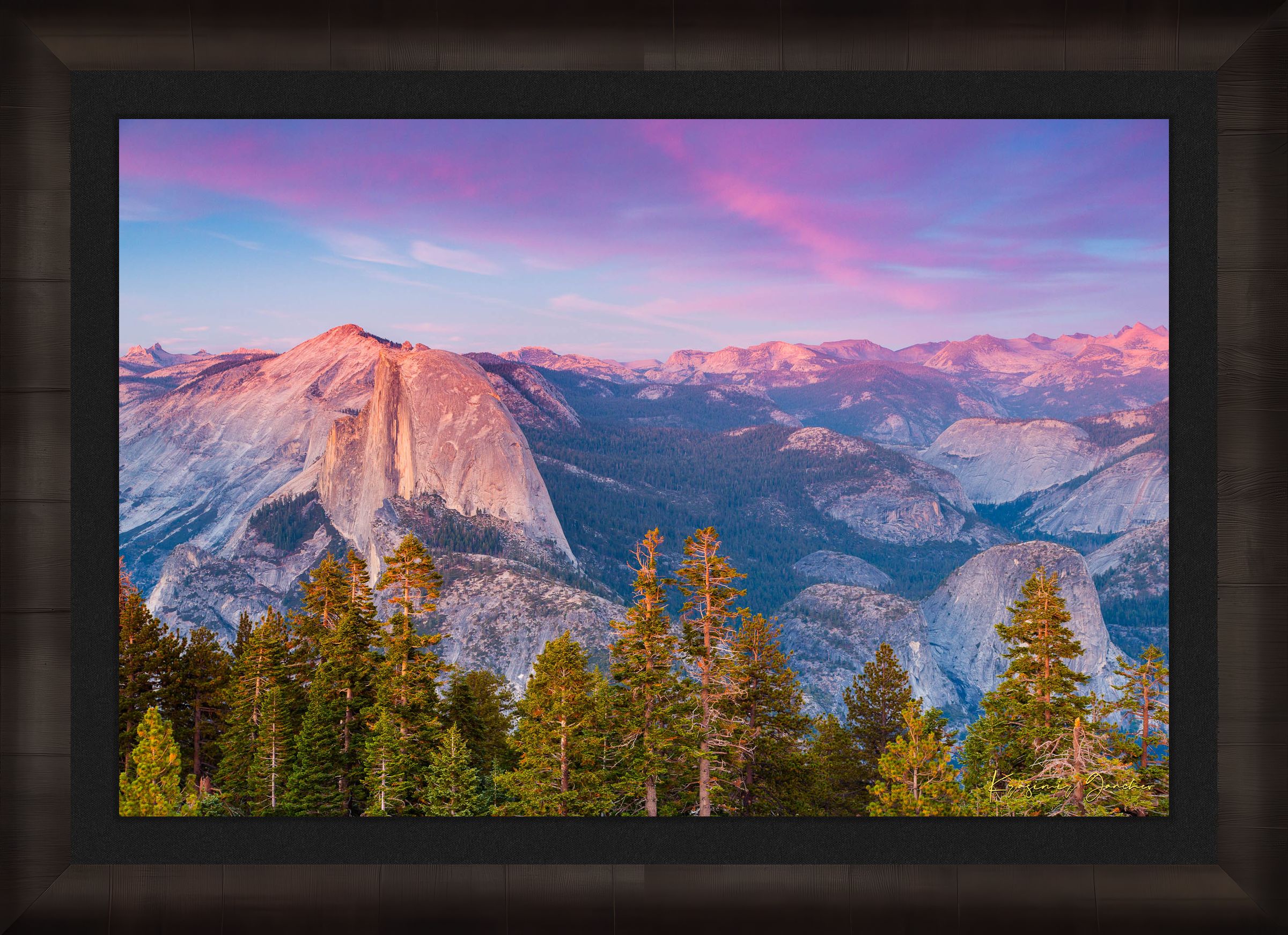 Granite monolith of Half Dome silhouetted against colorful sunset skies over Yosemite National Park with cloud layers. #Finish_Roma Dark Ash Frame & Dark Liner