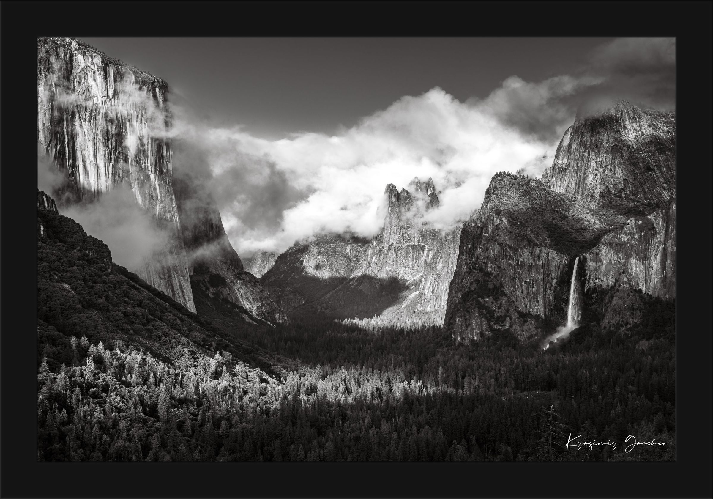 El Capitan granite monolith in Yosemite National Park during daylight, waterfalls cascading down cliffs, clouds above. #Finish_Roma Satin Black Frame