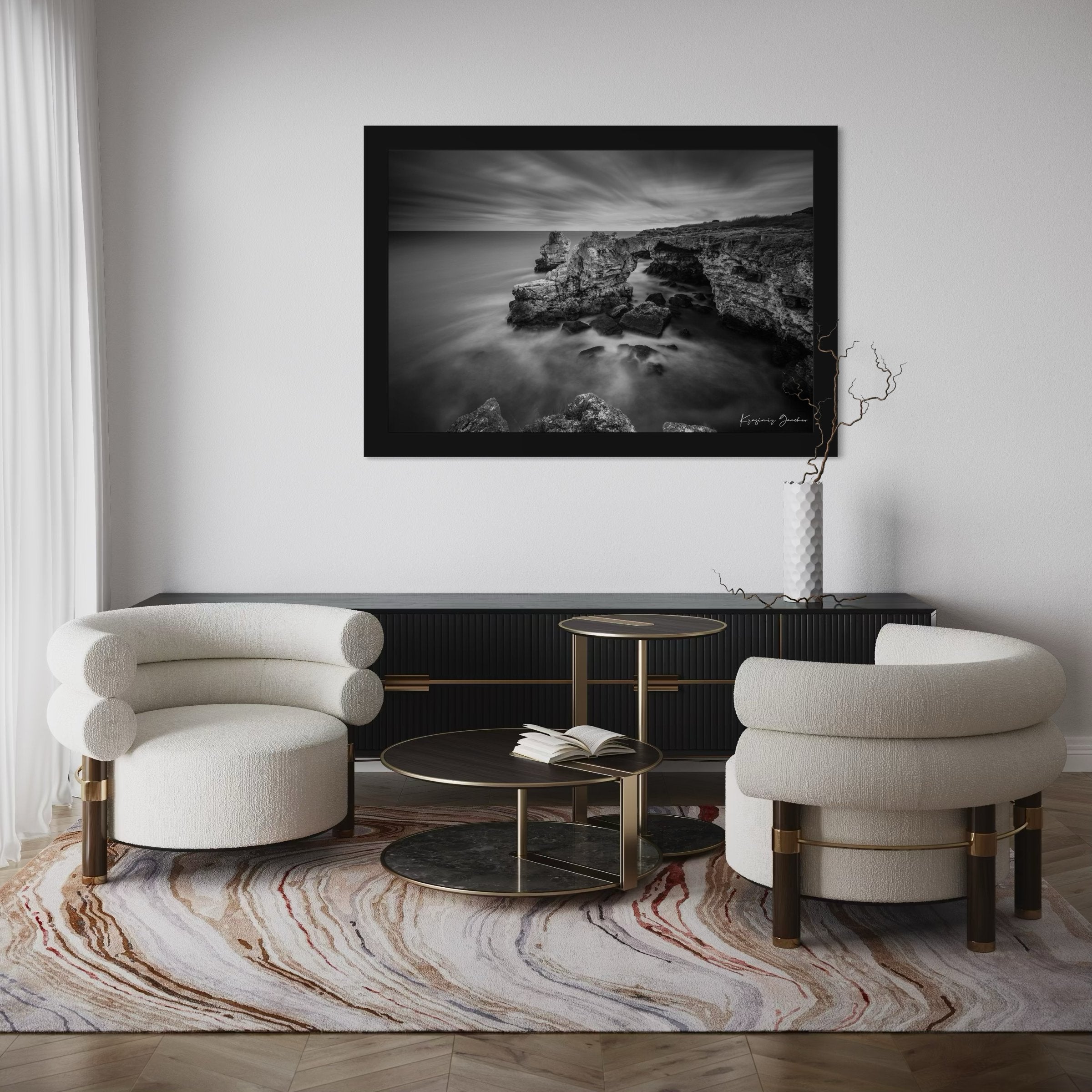 A stone arch formation near coastal cliffs in monochrome, with waves crashing against it. #Finish_Roma Satin Black Frame