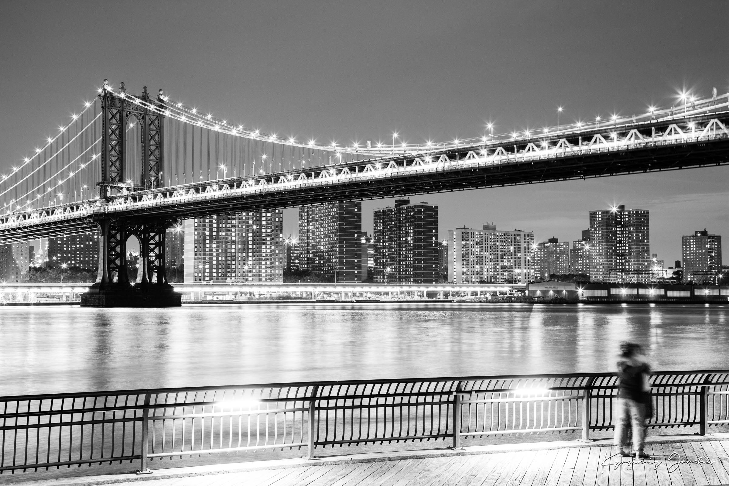 Monochrome Brooklyn Bridge at night across the Manhattan estuary, illuminated by city lights. #Finish_Acrylic Recess