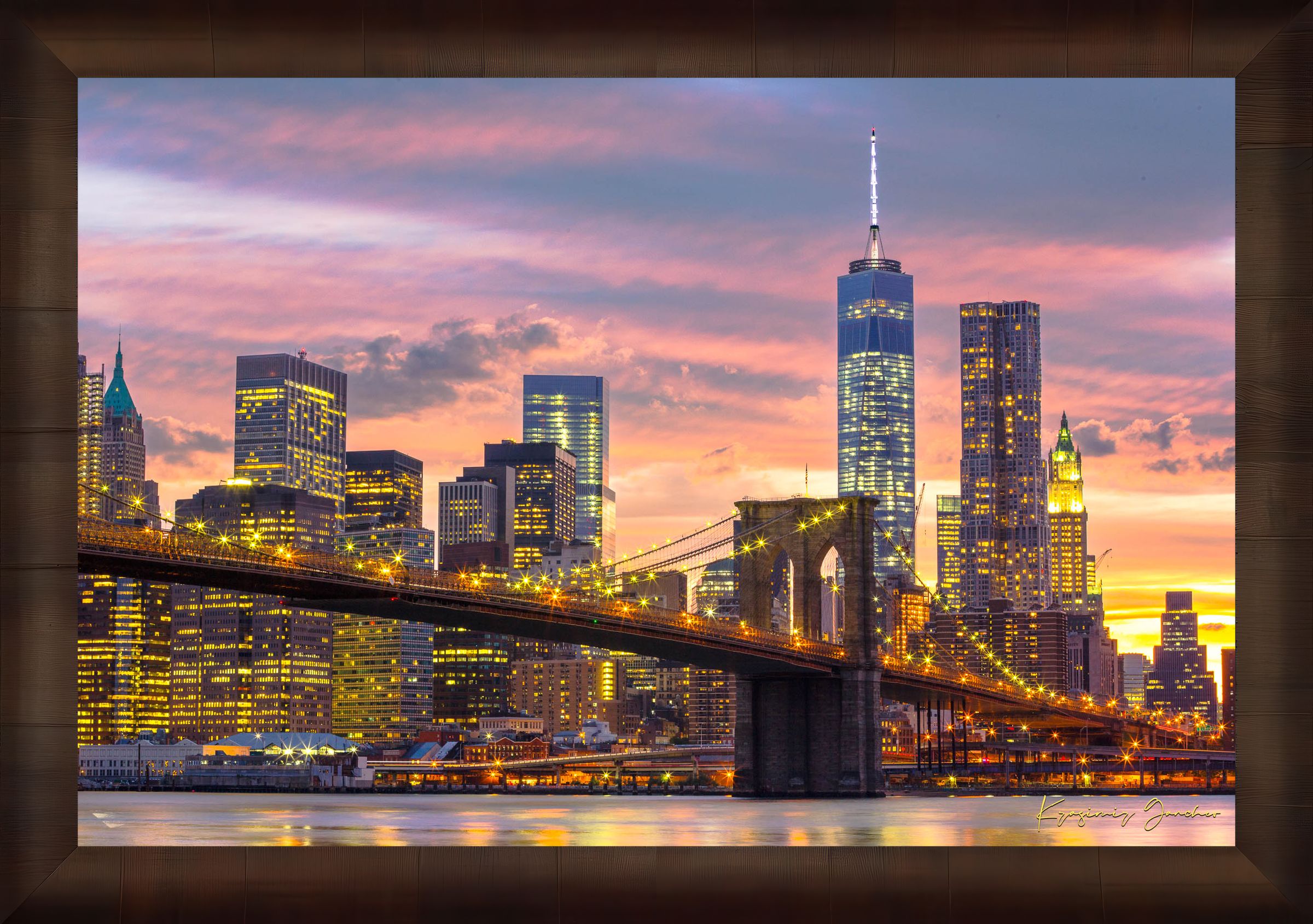 The Brooklyn Bridge viewed from Manhattan during evening hours as sunlight fades into artificial lighting under cloudy skies. #Finish_Roma Cigar Leaf Frame