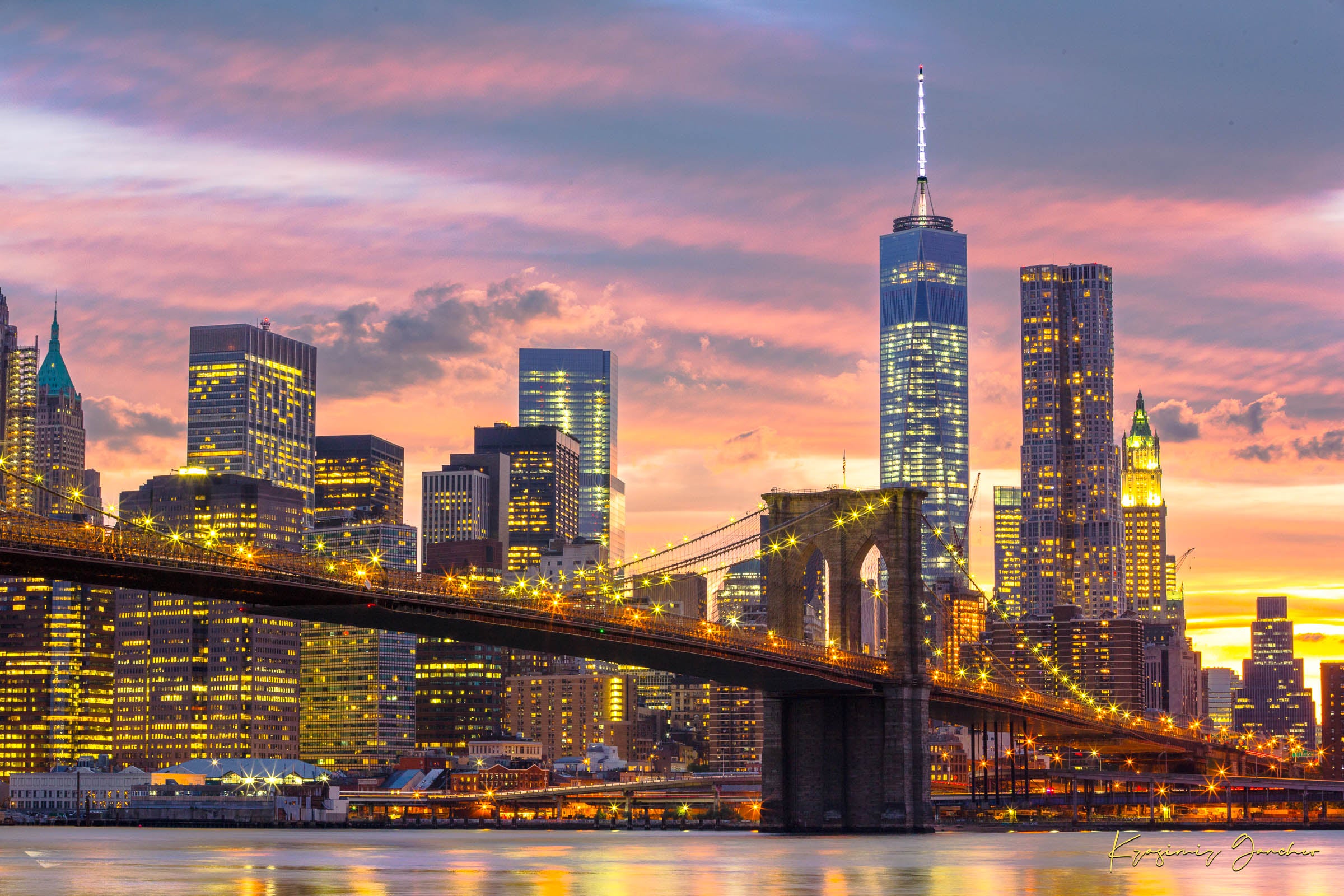 The Brooklyn Bridge viewed from Manhattan during evening hours as sunlight fades into artificial lighting under cloudy skies. #Finish_Acrylic Recess