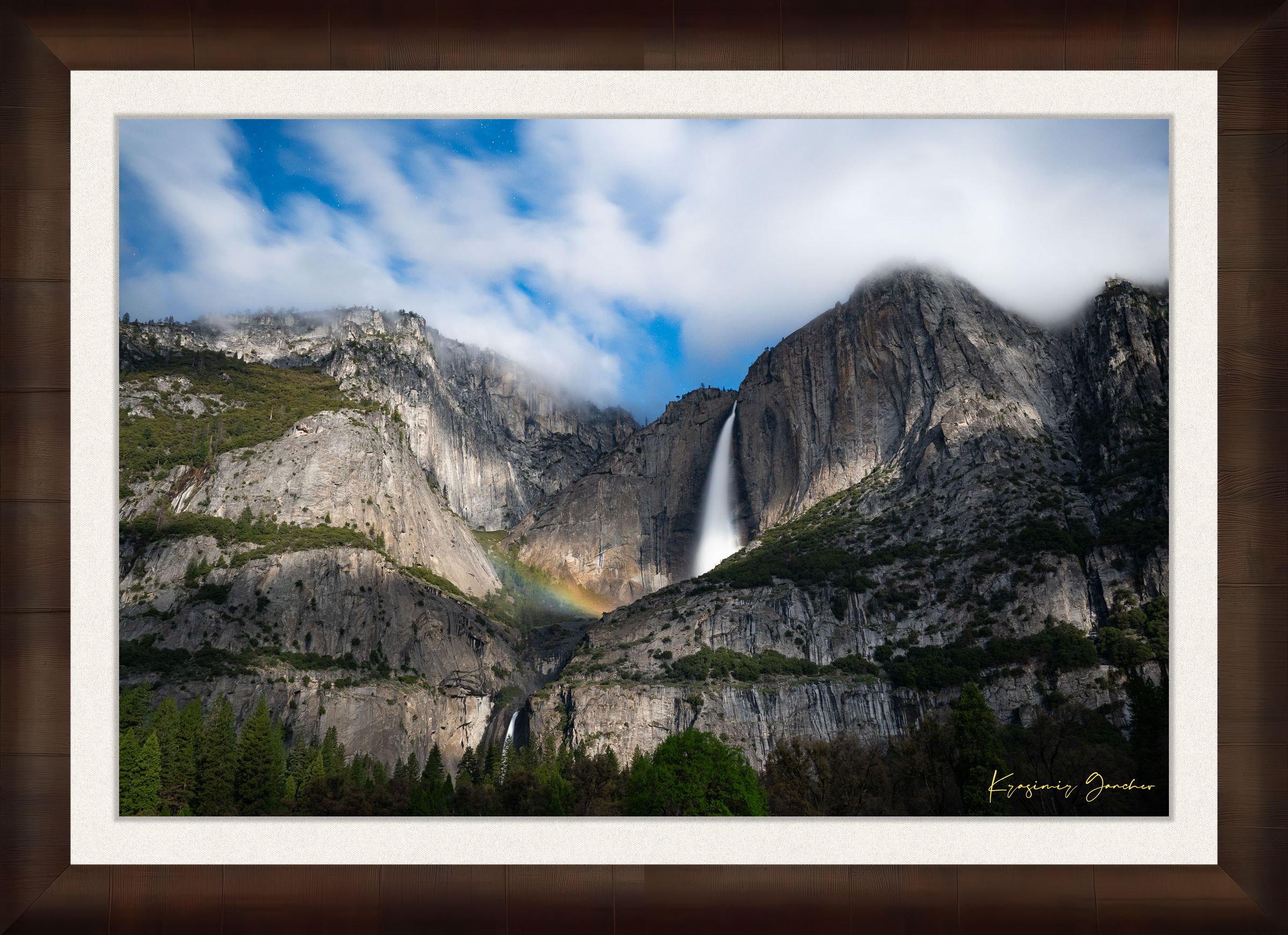 Yosemite Falls at night under starlight, illuminated by a faint silvery moonbow arching above the cascade within a cloudy mountain valley. #Finish_Roma Cigar Leaf Frame & Bright Liner