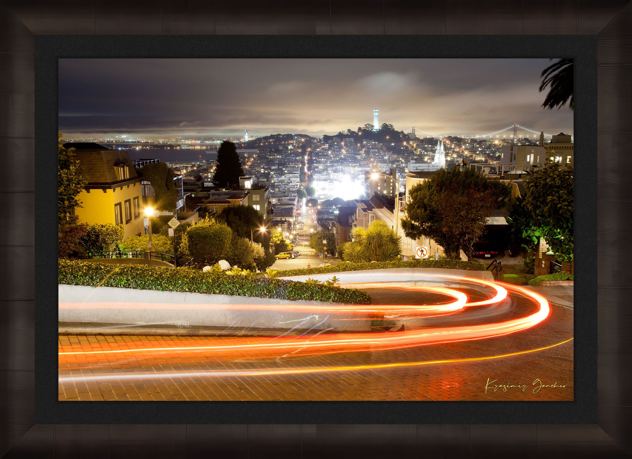 Nighttime Lombard Street in San Francisco showing long exposure light trails under cloudy skies. #Finish_Roma Dark Ash Frame & Dark Liner