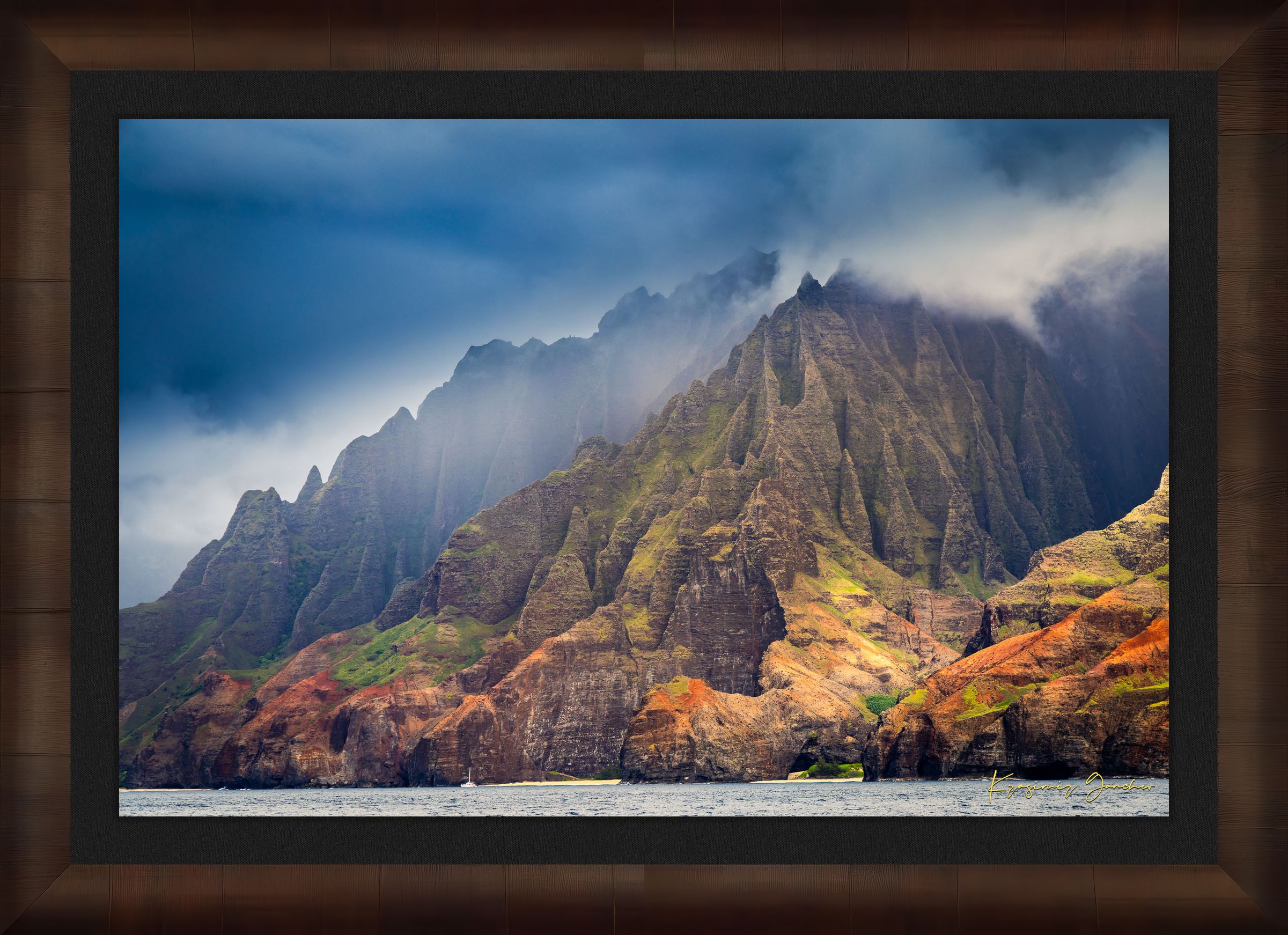 Rugged coastal cliff face rising from the Pacific Ocean at Napali Coast, Kauai, with light breaking through storm clouds. #Finish_Roma Cigar Leaf Frame & Dark Liner
