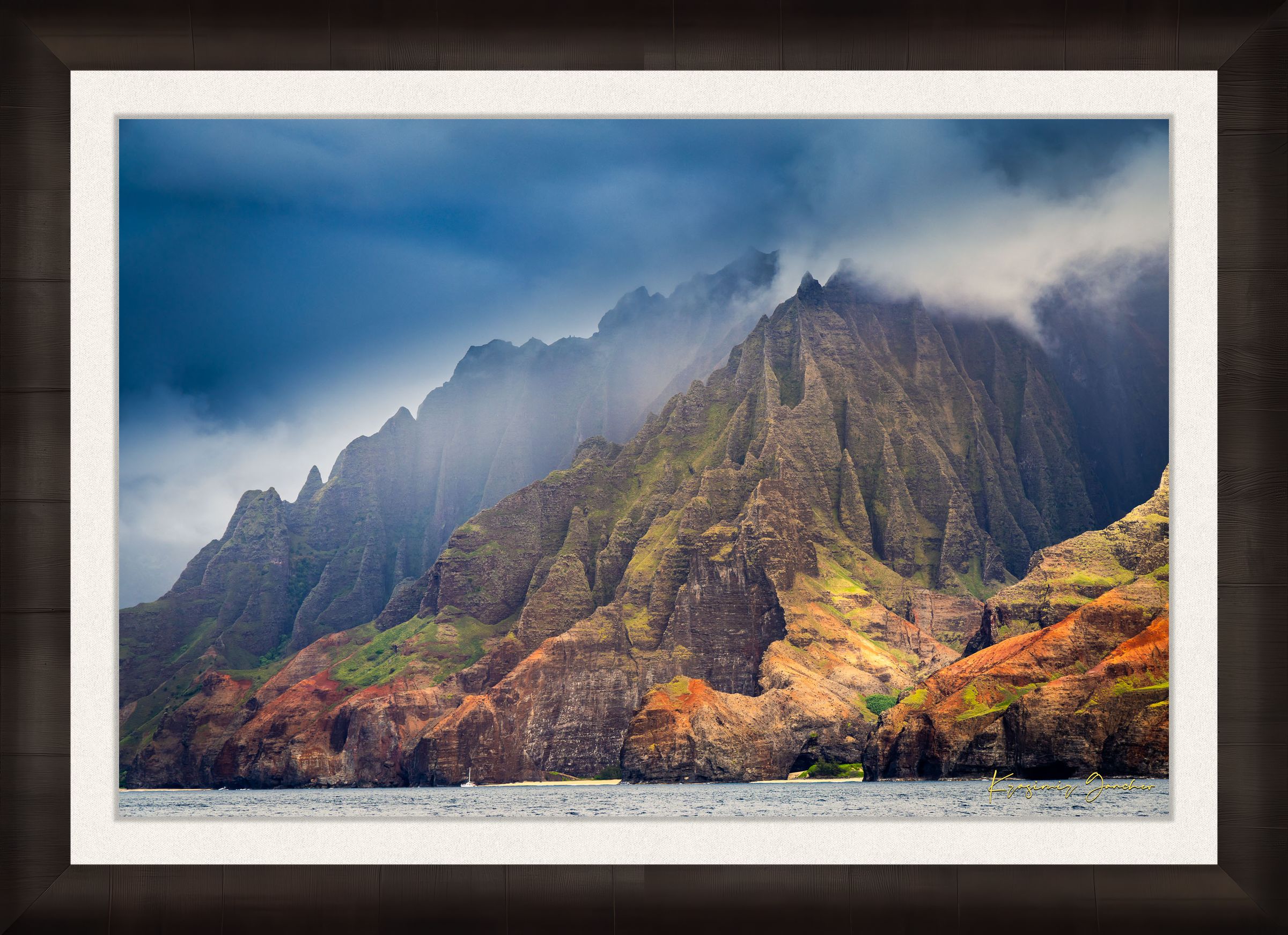 Rugged coastal cliff face rising from the Pacific Ocean at Napali Coast, Kauai, with light breaking through storm clouds. #Finish_Roma Dark Ash Frame & Bright Liner