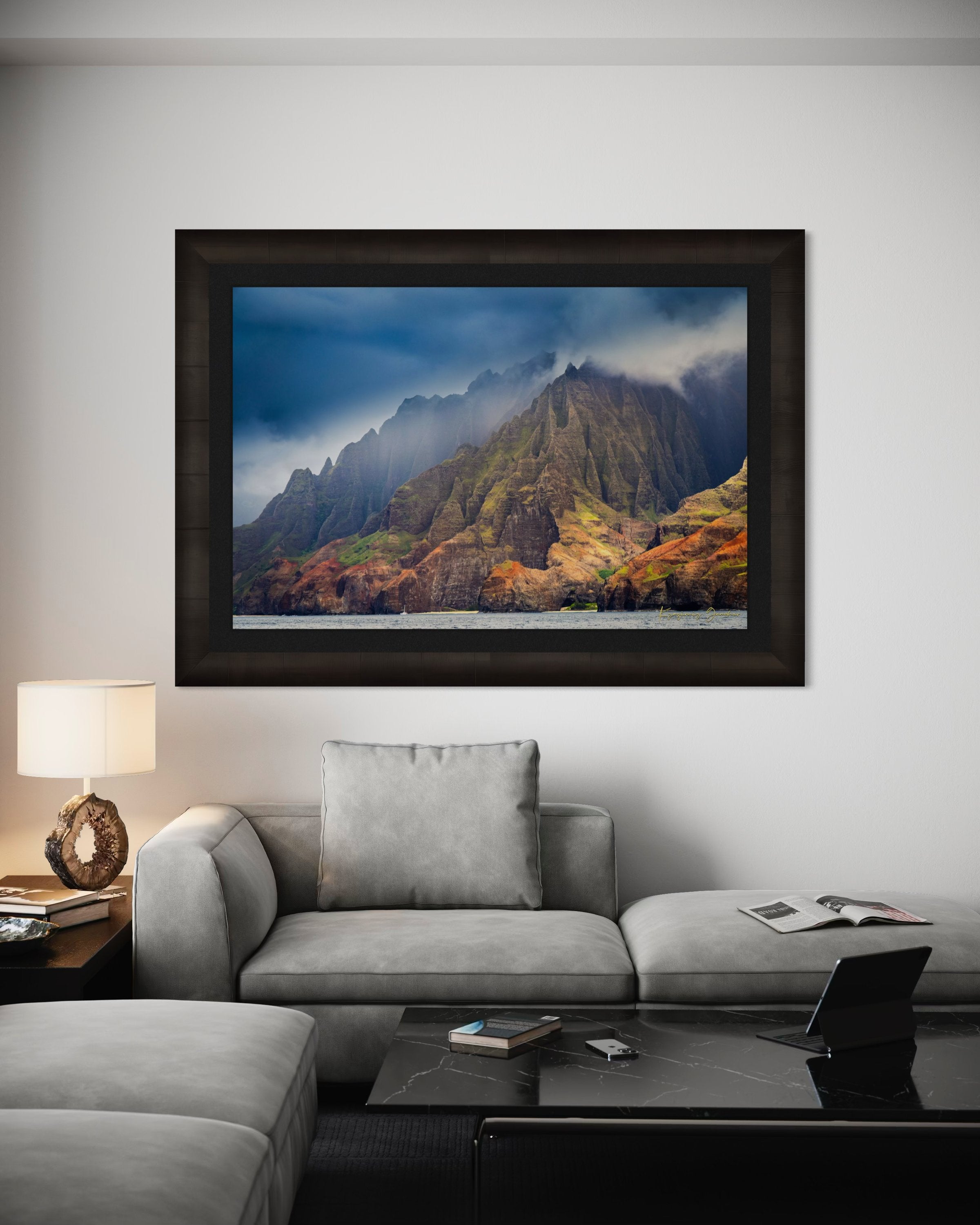 Rugged coastal cliff face rising from the Pacific Ocean at Napali Coast, Kauai, with light breaking through storm clouds. #Finish_Roma Dark Ash Frame & Dark Liner