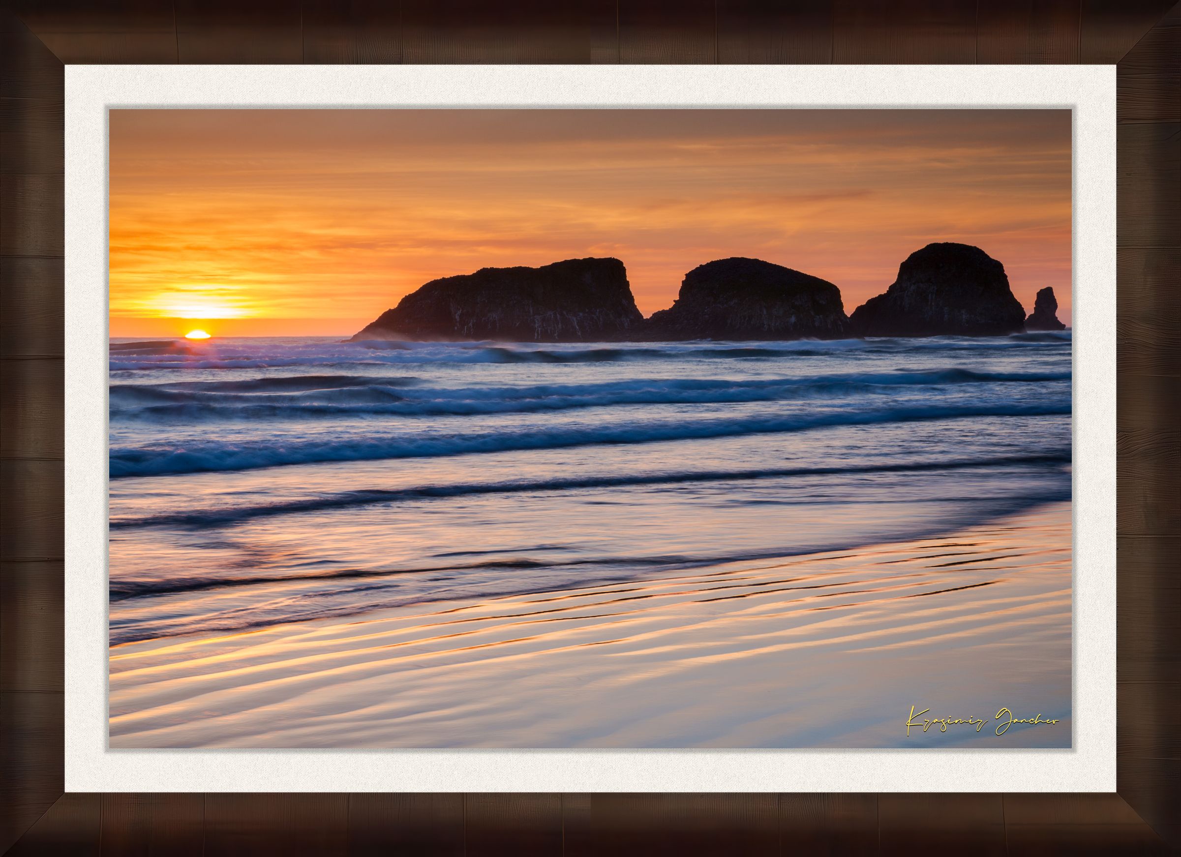 Bird Rock at Cannon Beach, Oregon, during sunset with reflections in the wet sand and ocean under cloudy skies. #Finish_Roma Cigar Leaf Frame & Bright Liner