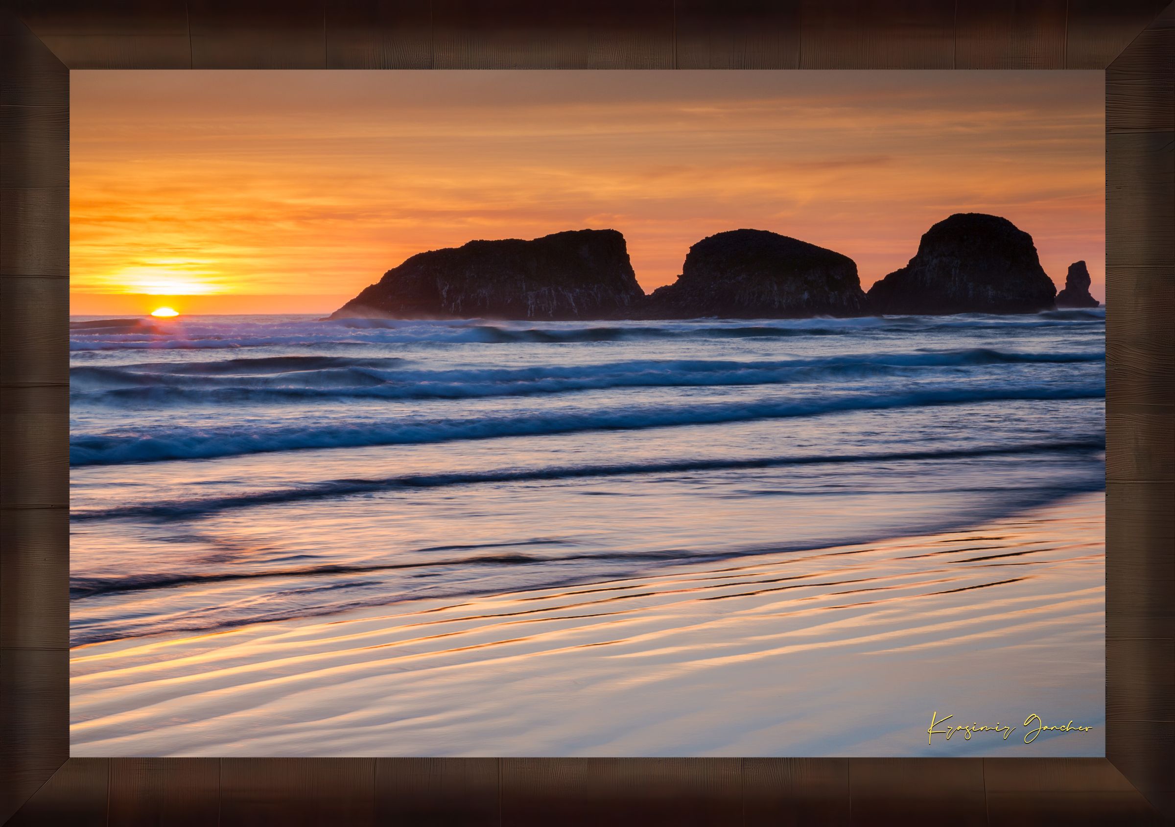 Bird Rock at Cannon Beach, Oregon, during sunset with reflections in the wet sand and ocean under cloudy skies. #Finish_Roma Cigar Leaf Frame